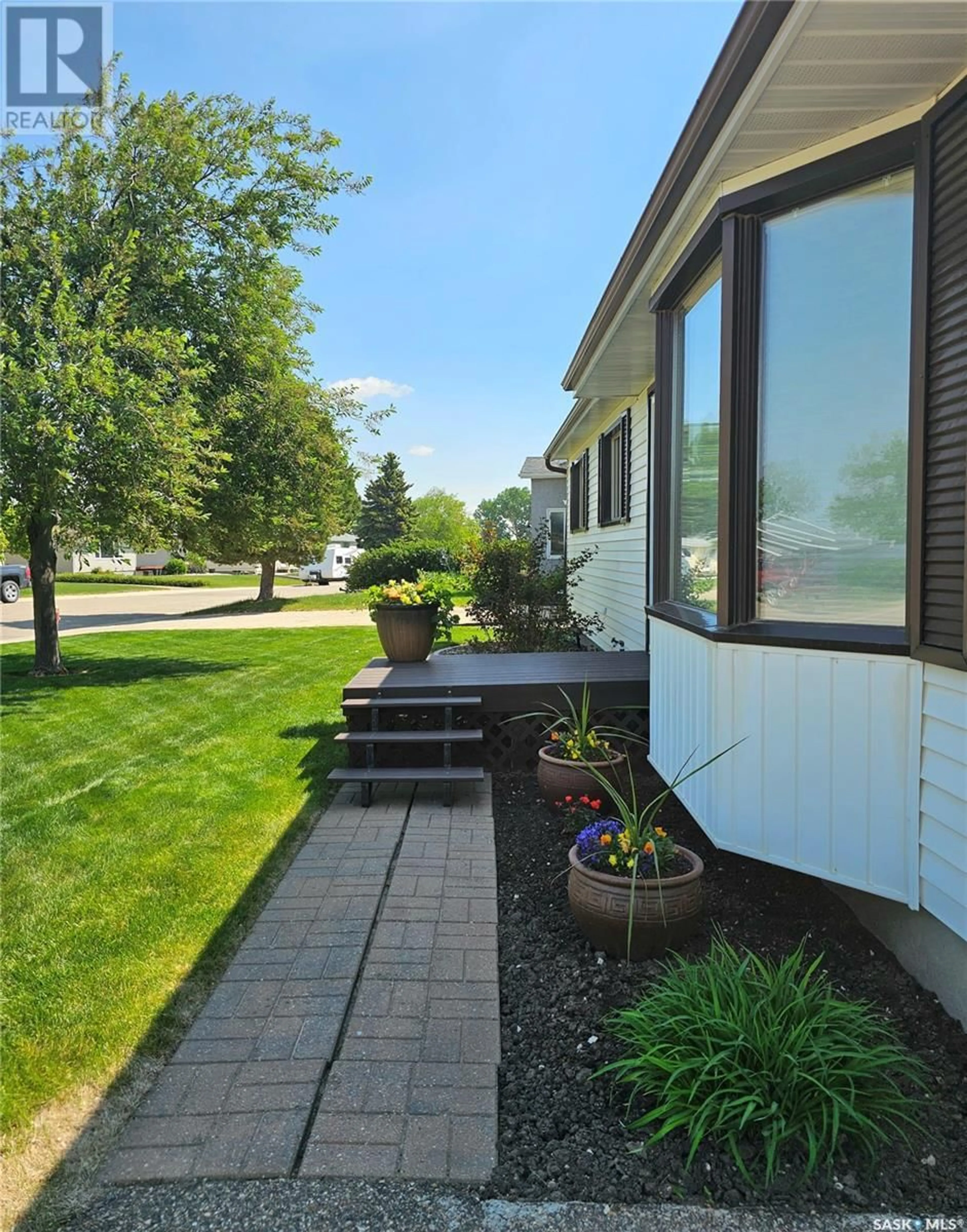 Home with vinyl exterior material, street for 84 WEAVER CRESCENT, Swift Current Saskatchewan S9H4B9