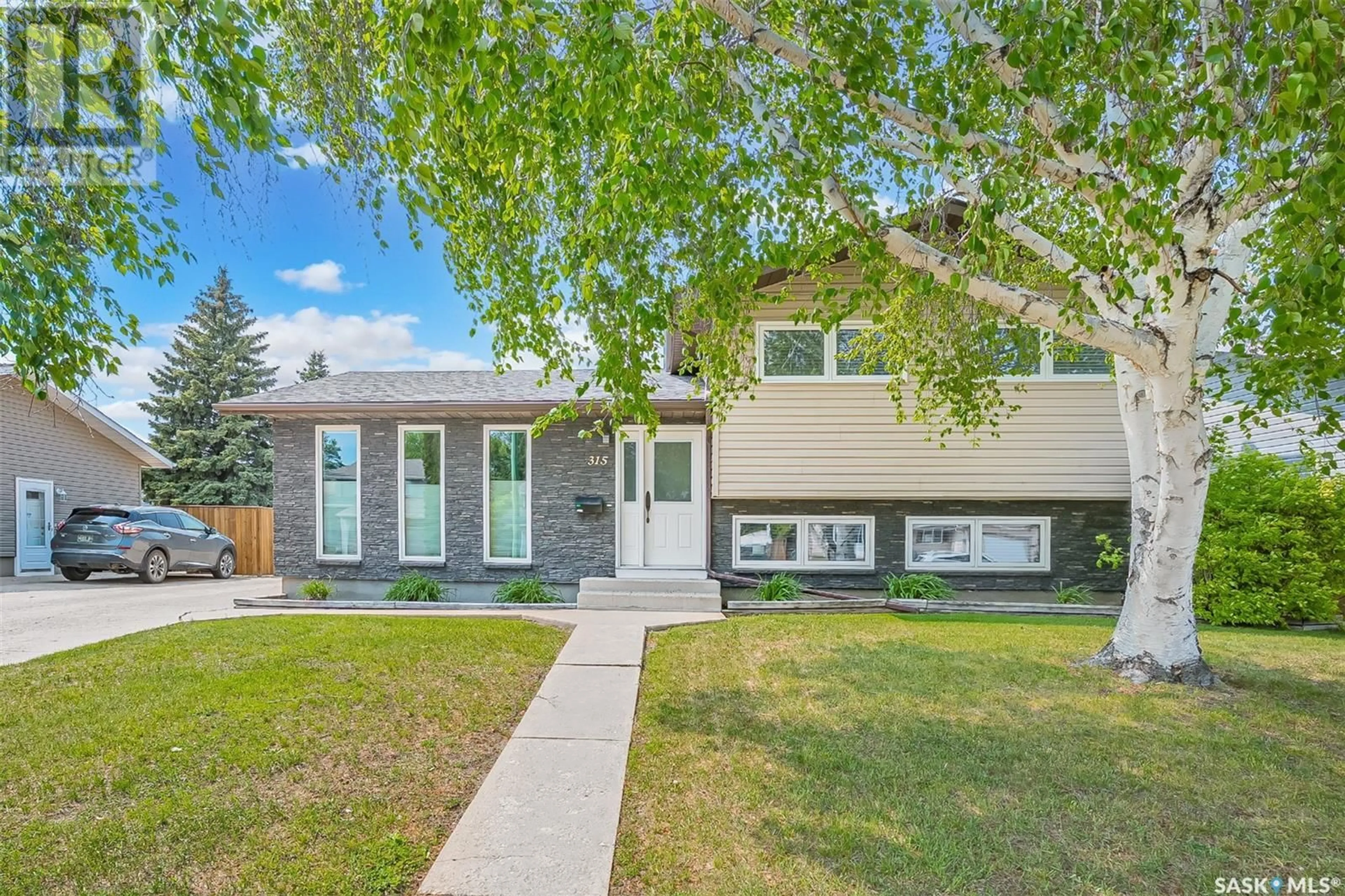 Home with vinyl exterior material, street for 315 QUILL CRESCENT, Saskatoon Saskatchewan S7K4V3