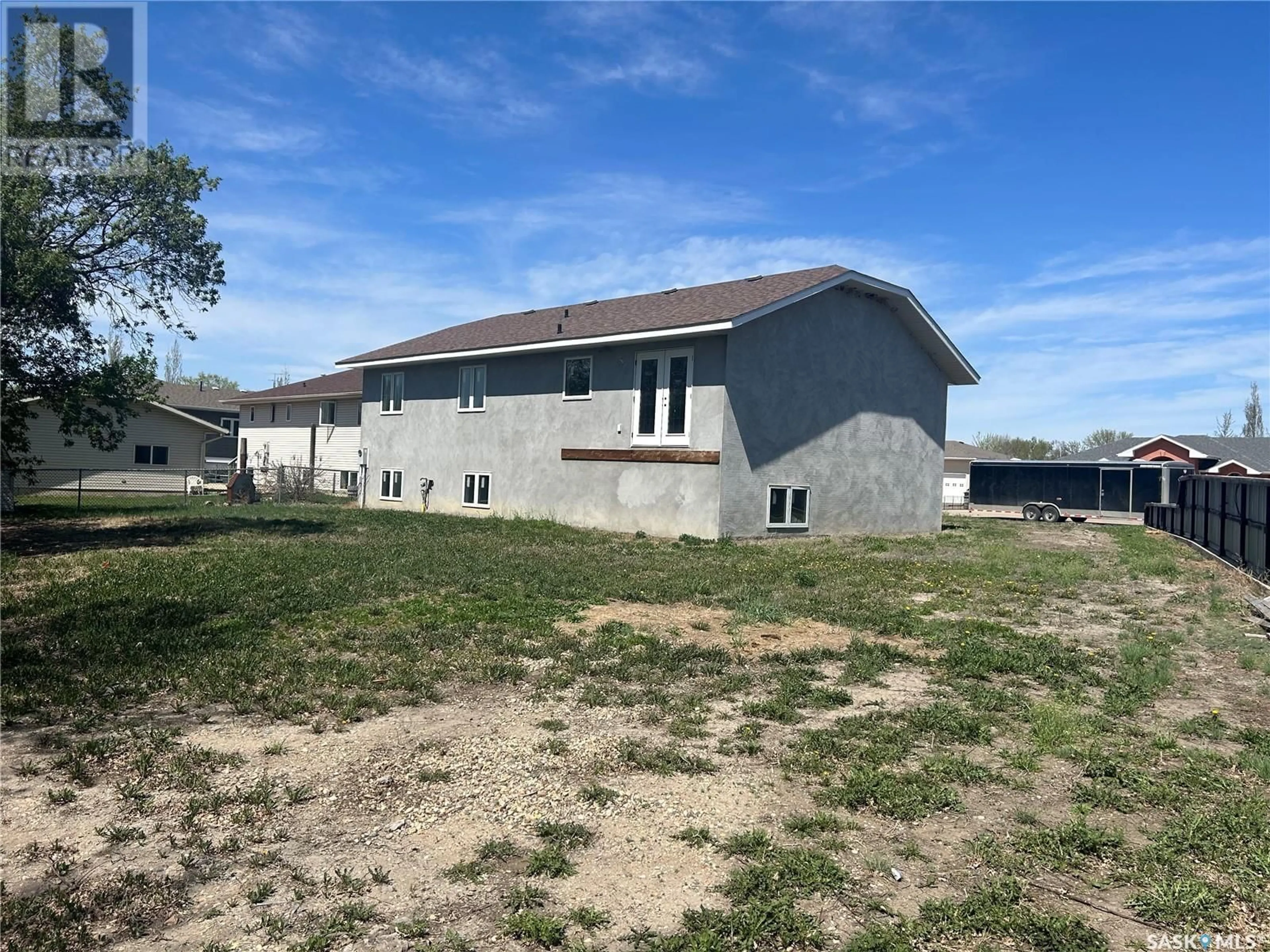 A pic from outside/outdoor area/front of a property/back of a property/a pic from drone, building for 117 CARSON BAY, Lampman Saskatchewan S0C0B5