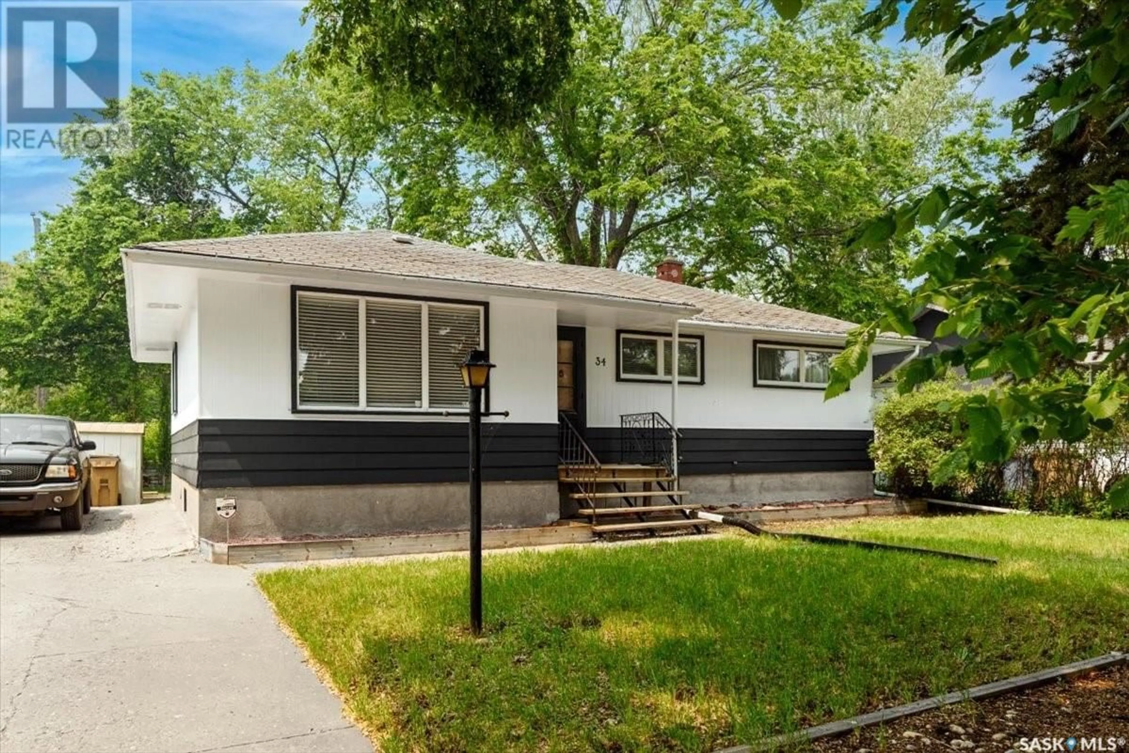 Home with vinyl exterior material, street for 34 MACLEAN STREET, Regina Saskatchewan S4R4T7