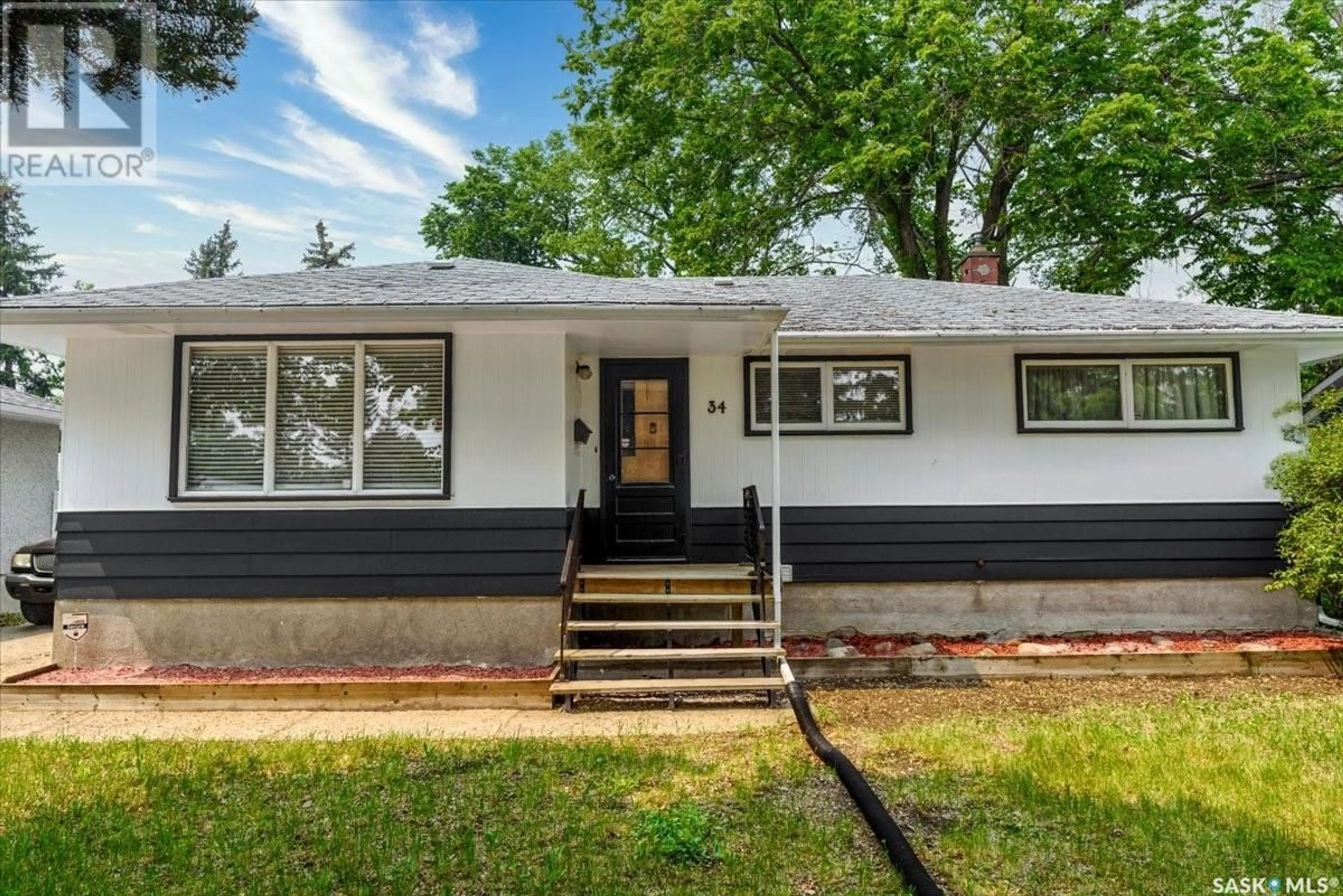 Home with vinyl exterior material, street for 34 MACLEAN STREET, Regina Saskatchewan S4R4T7