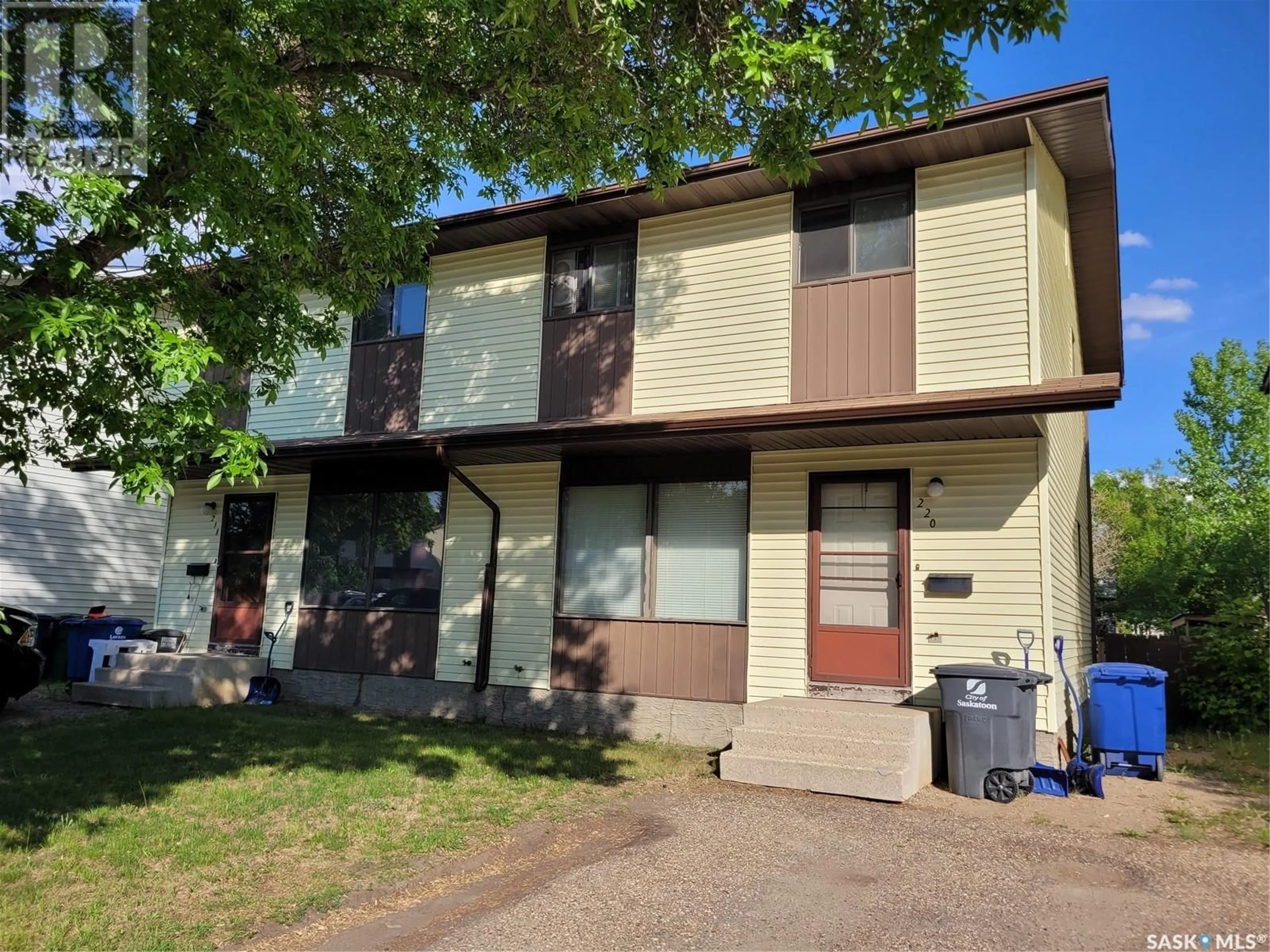 Home with vinyl exterior material, street for 218 220 WAKABAYASHI WAY, Saskatoon Saskatchewan S7K7M2