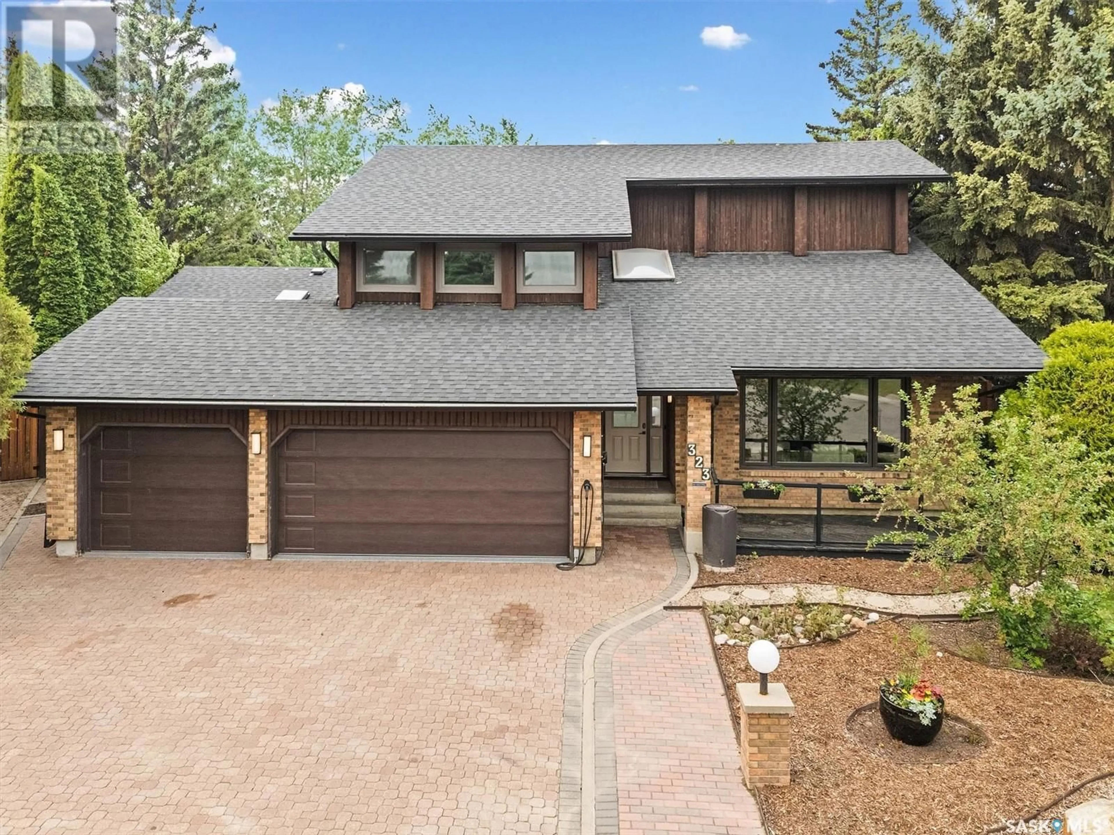 Home with brick exterior material, street for 323 LAKESHORE COURT, Saskatoon Saskatchewan S7J3T6