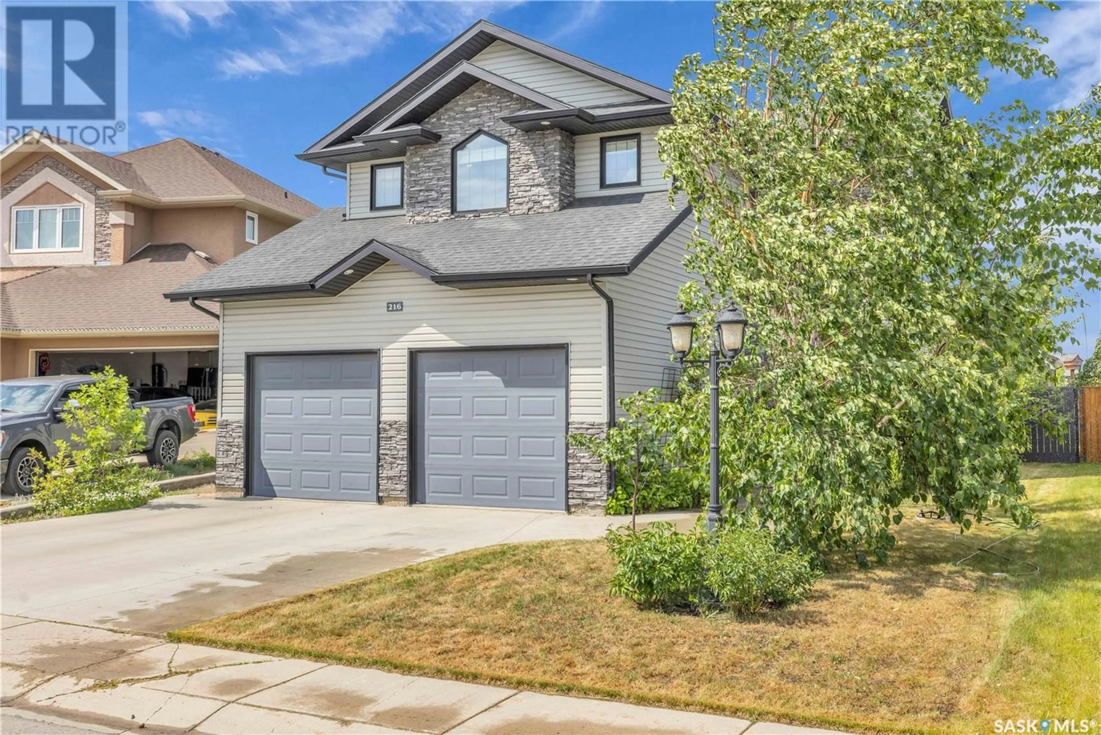 Home with brick exterior material, street for 216 FLOYD COURT, Warman Saskatchewan S0K4S1