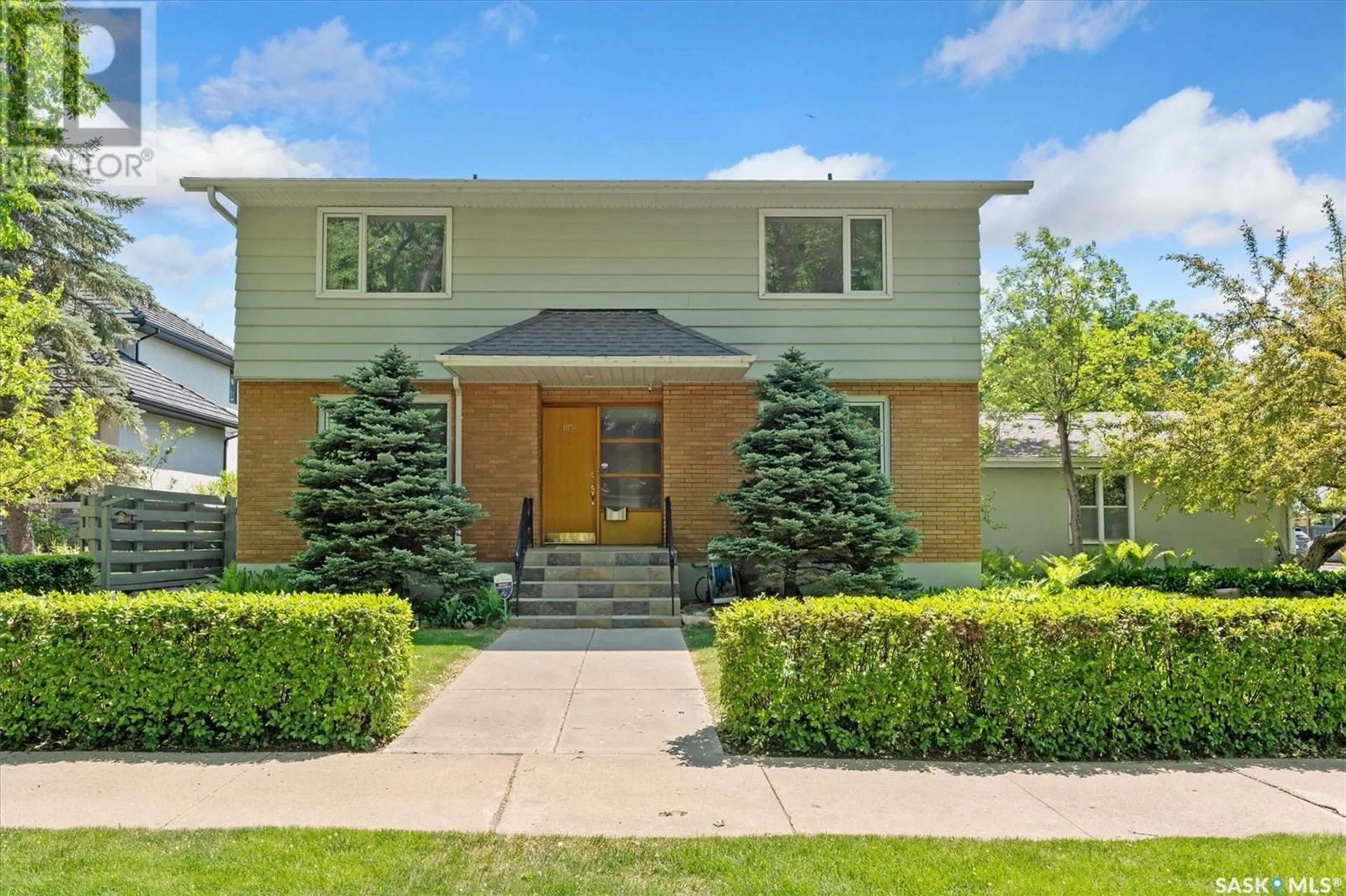 Home with brick exterior material, street for 1104 ELLIOTT STREET, Saskatoon Saskatchewan S7N0V3