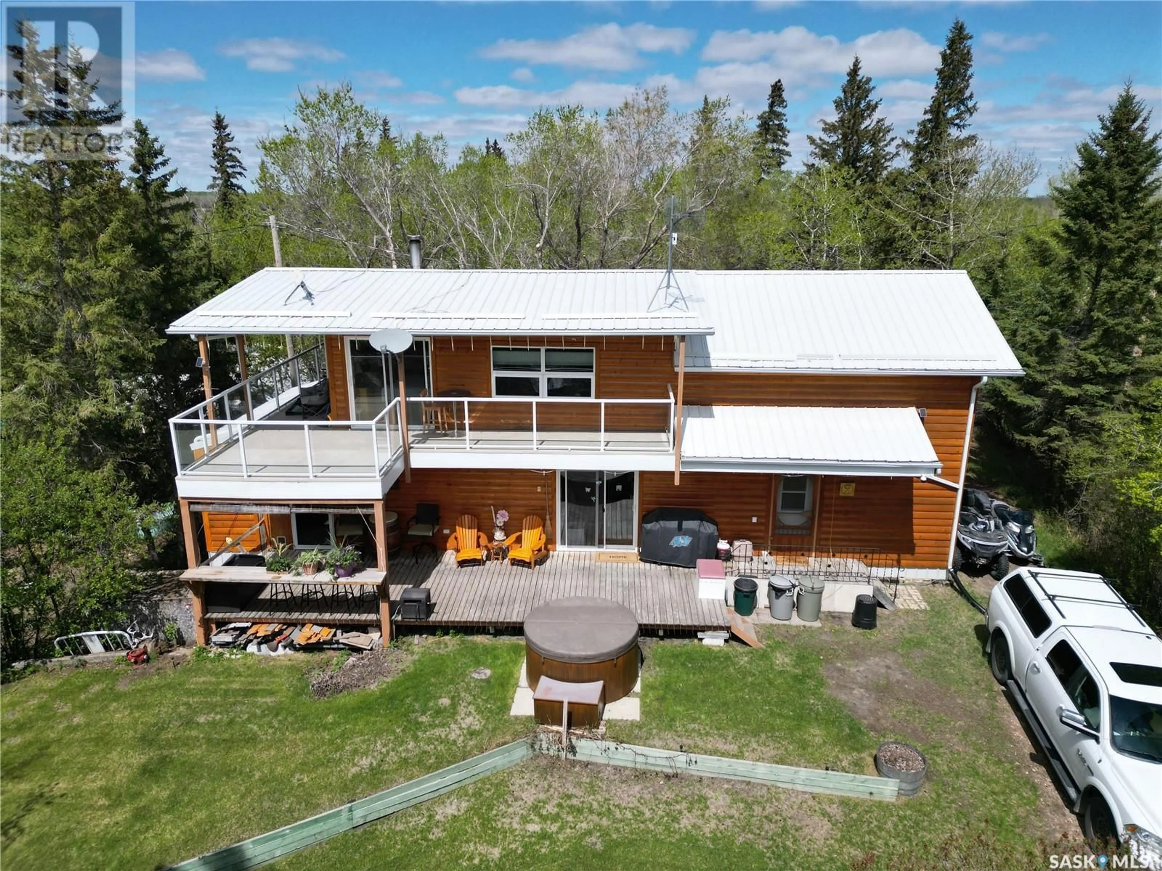 A pic from outside/outdoor area/front of a property/back of a property/a pic from drone, building for 910 SUNSET CRESCENT, Good Lake Rm No. 274 Saskatchewan S0A0L0