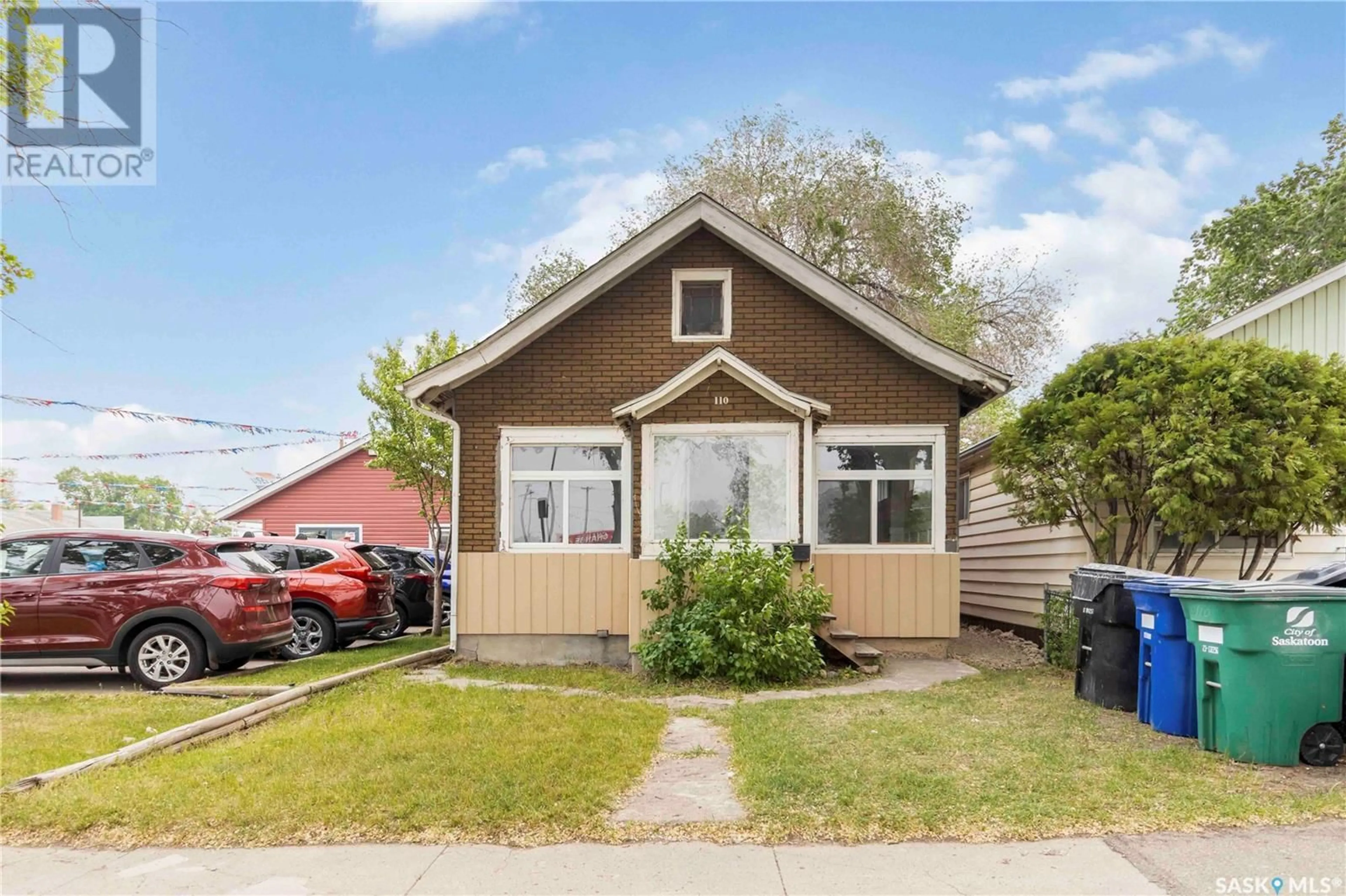 Home with vinyl exterior material, street for 110 F AVENUE, Saskatoon Saskatchewan S7M1S8