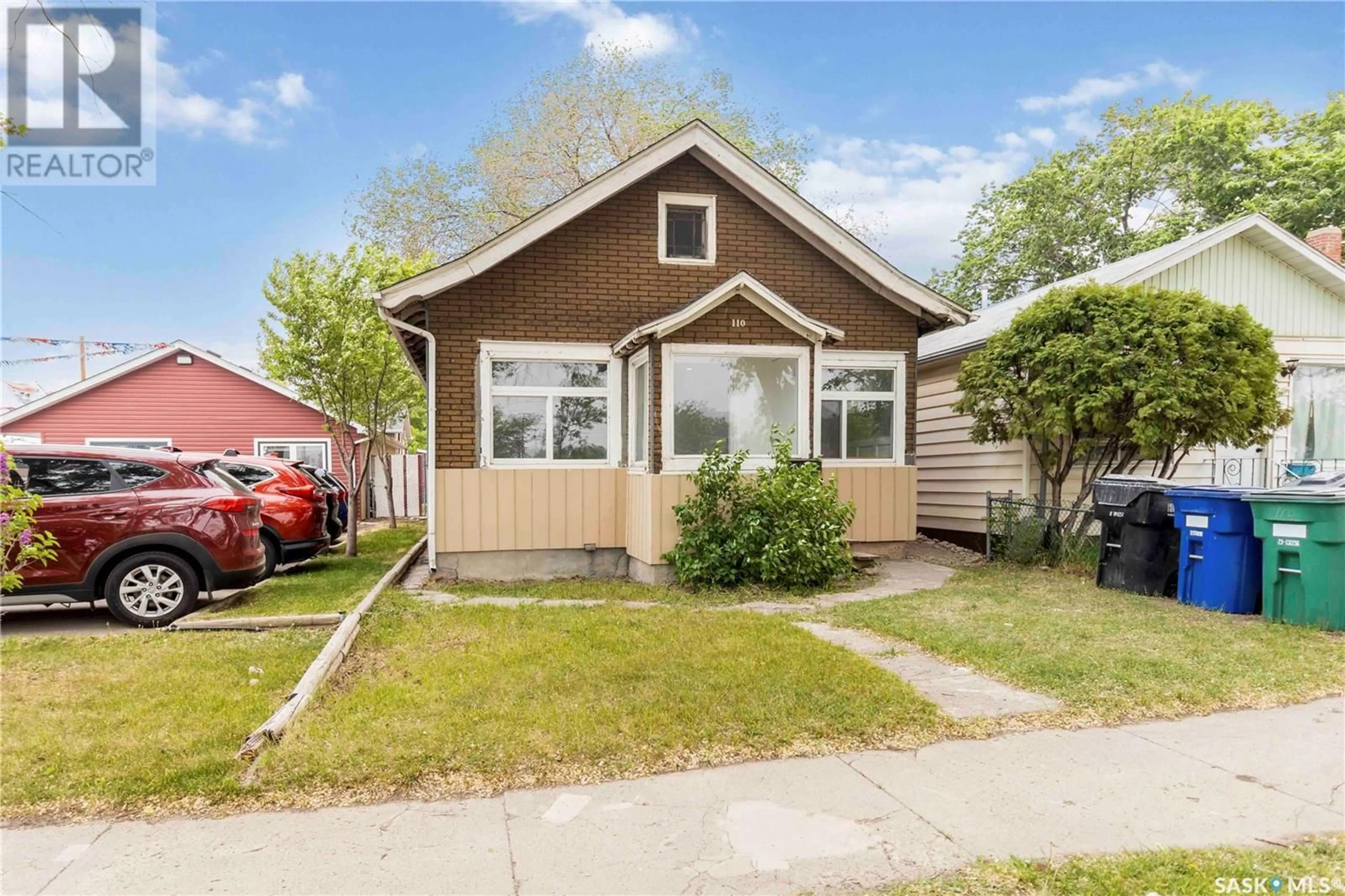 Home with vinyl exterior material, street for 110 F AVENUE, Saskatoon Saskatchewan S7M1S8