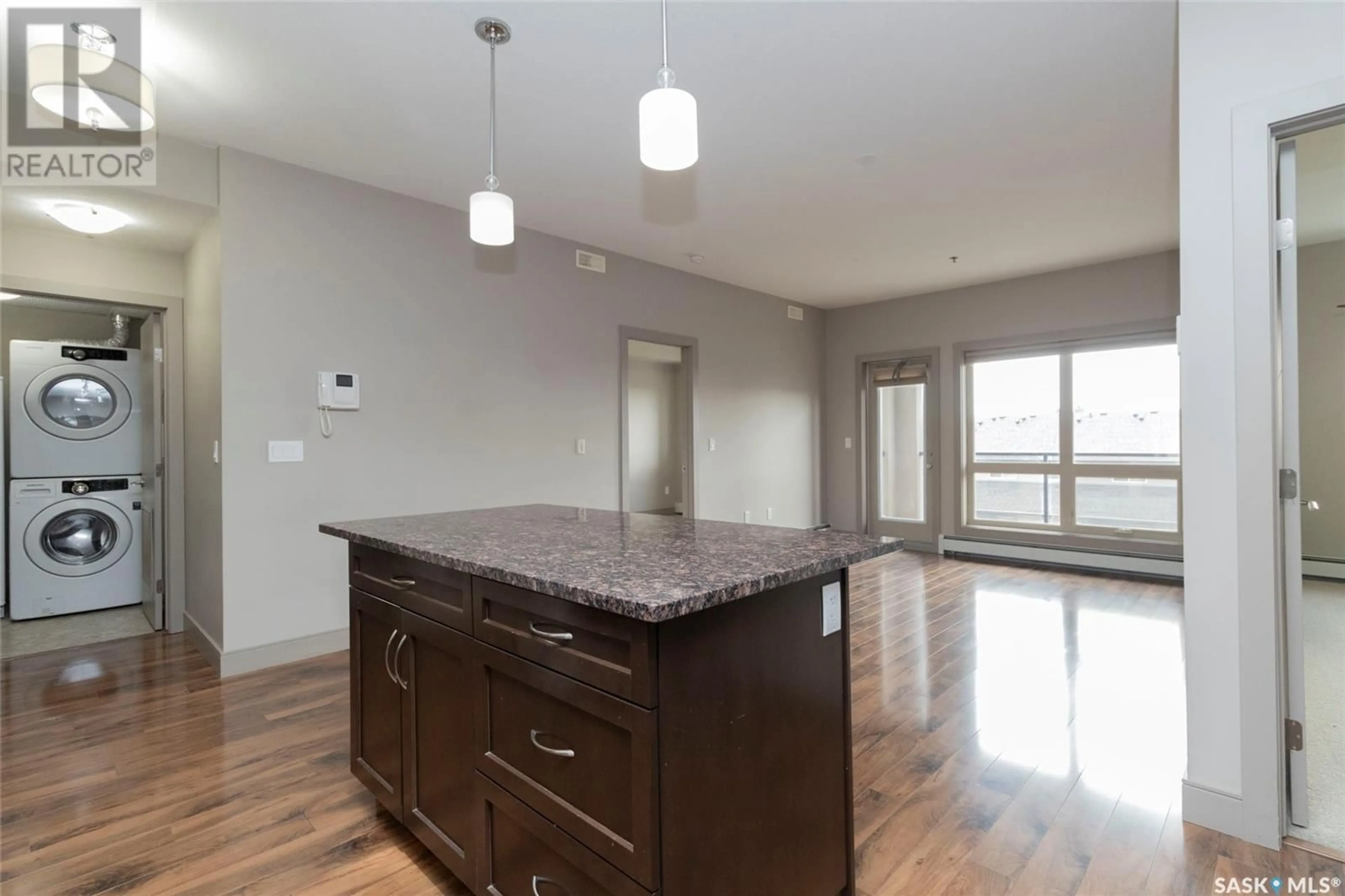 Open concept kitchen, wood/laminate floor for 204 115 WILLOWGROVE CRESCENT, Saskatoon Saskatchewan S7W0N4