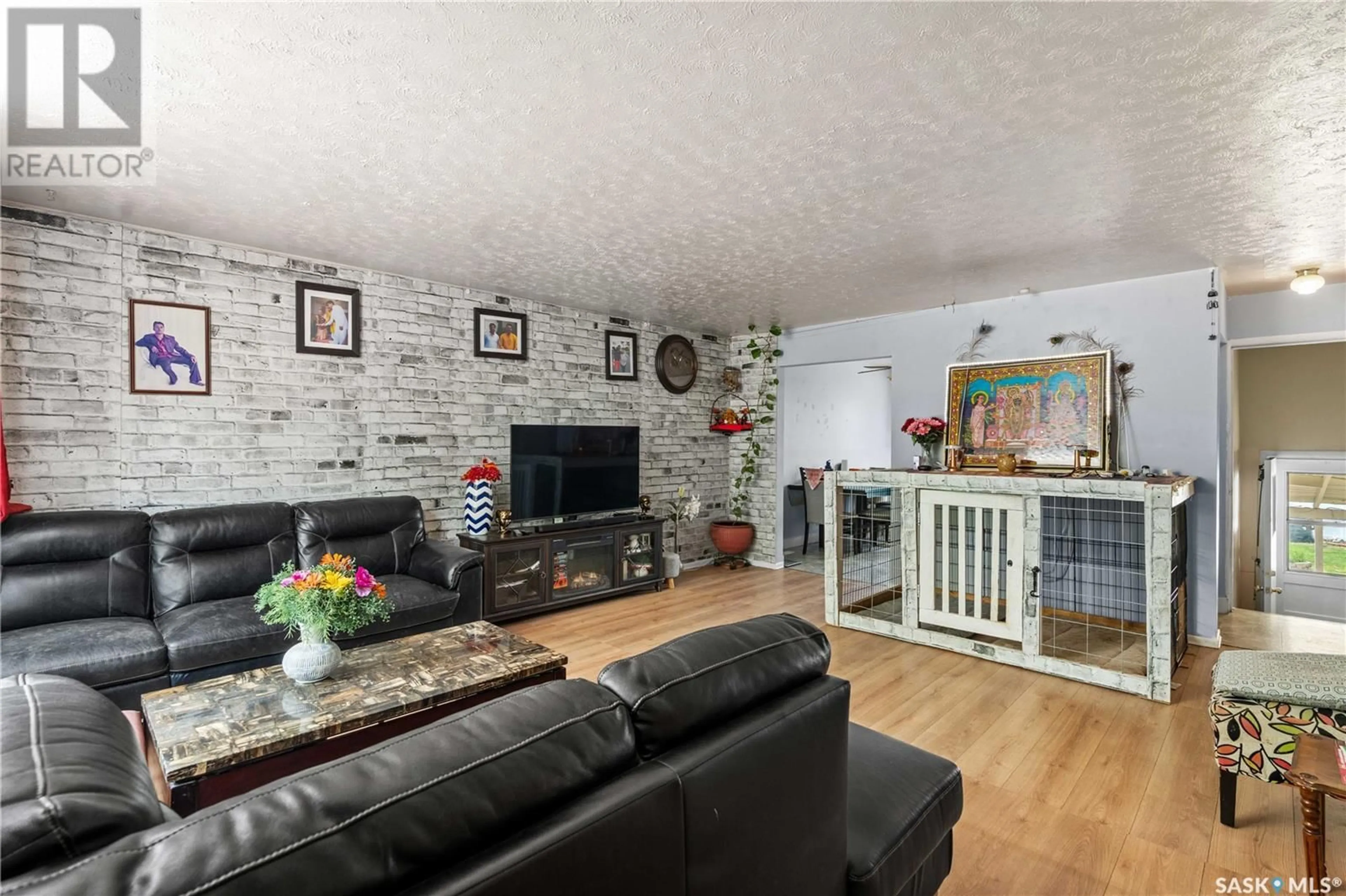 Living room with furniture, wood/laminate floor for 1440 RUPERT STREET, Regina Saskatchewan S4N1V8