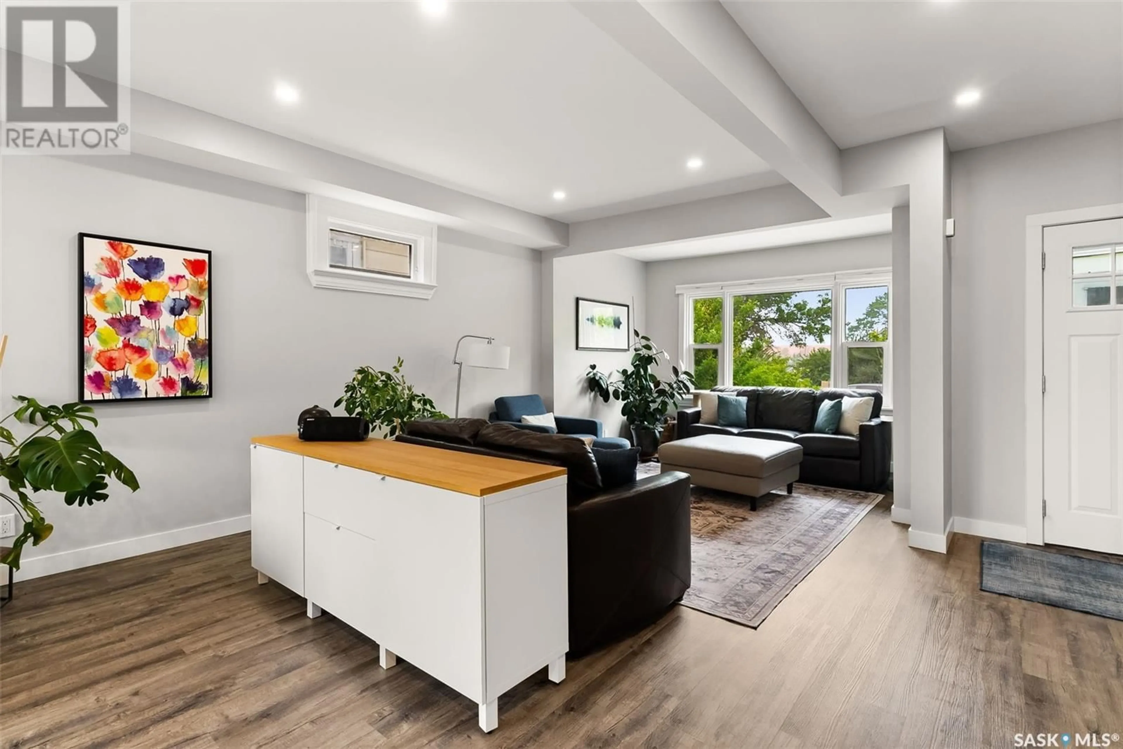 Living room with furniture, wood/laminate floor for 3809 VICTORIA AVENUE, Regina Saskatchewan S4T1M6