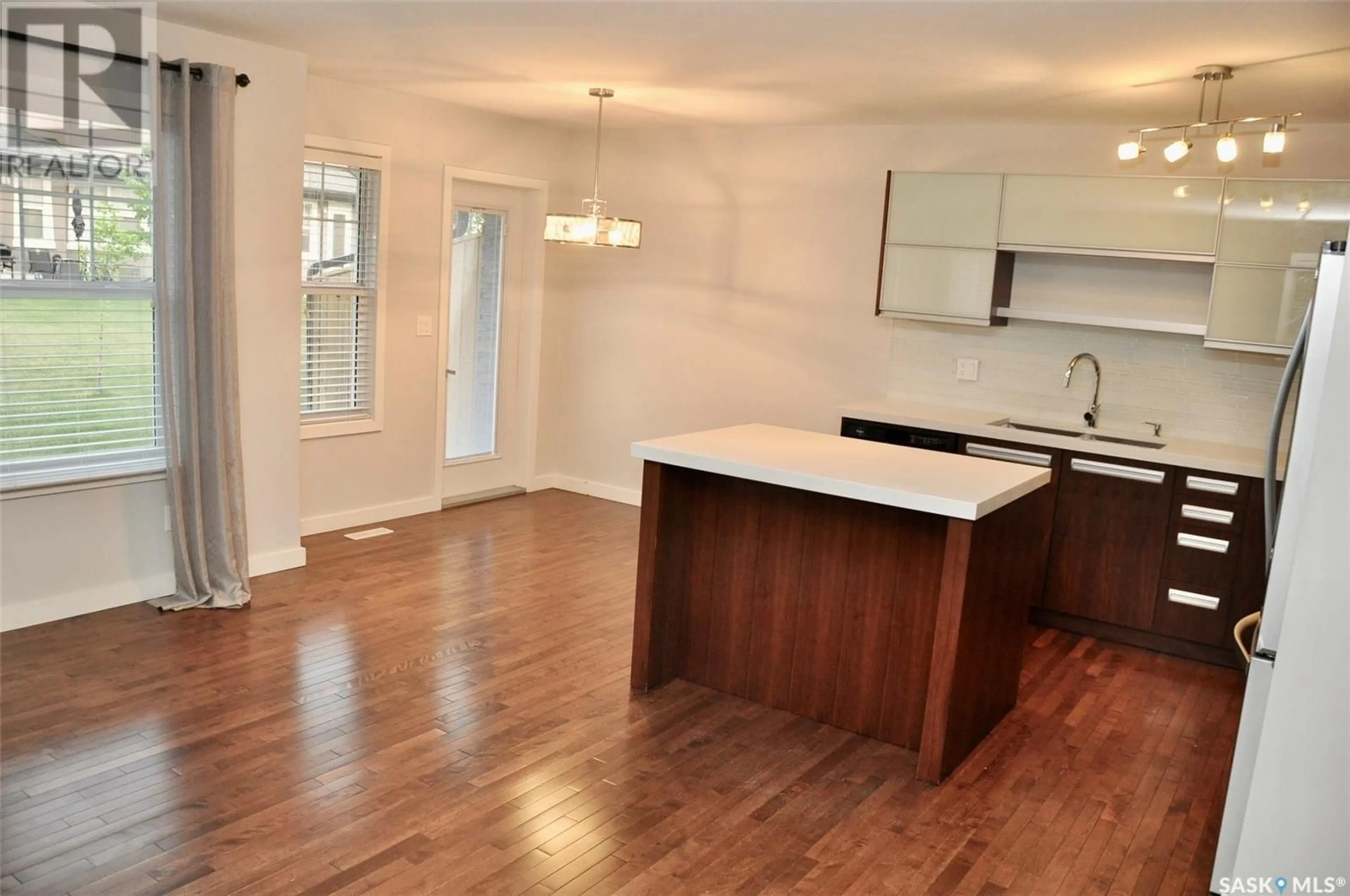 Open concept kitchen, wood/laminate floor for 305 - 1303 PATON CRESCENT, Saskatoon Saskatchewan S7W0P6