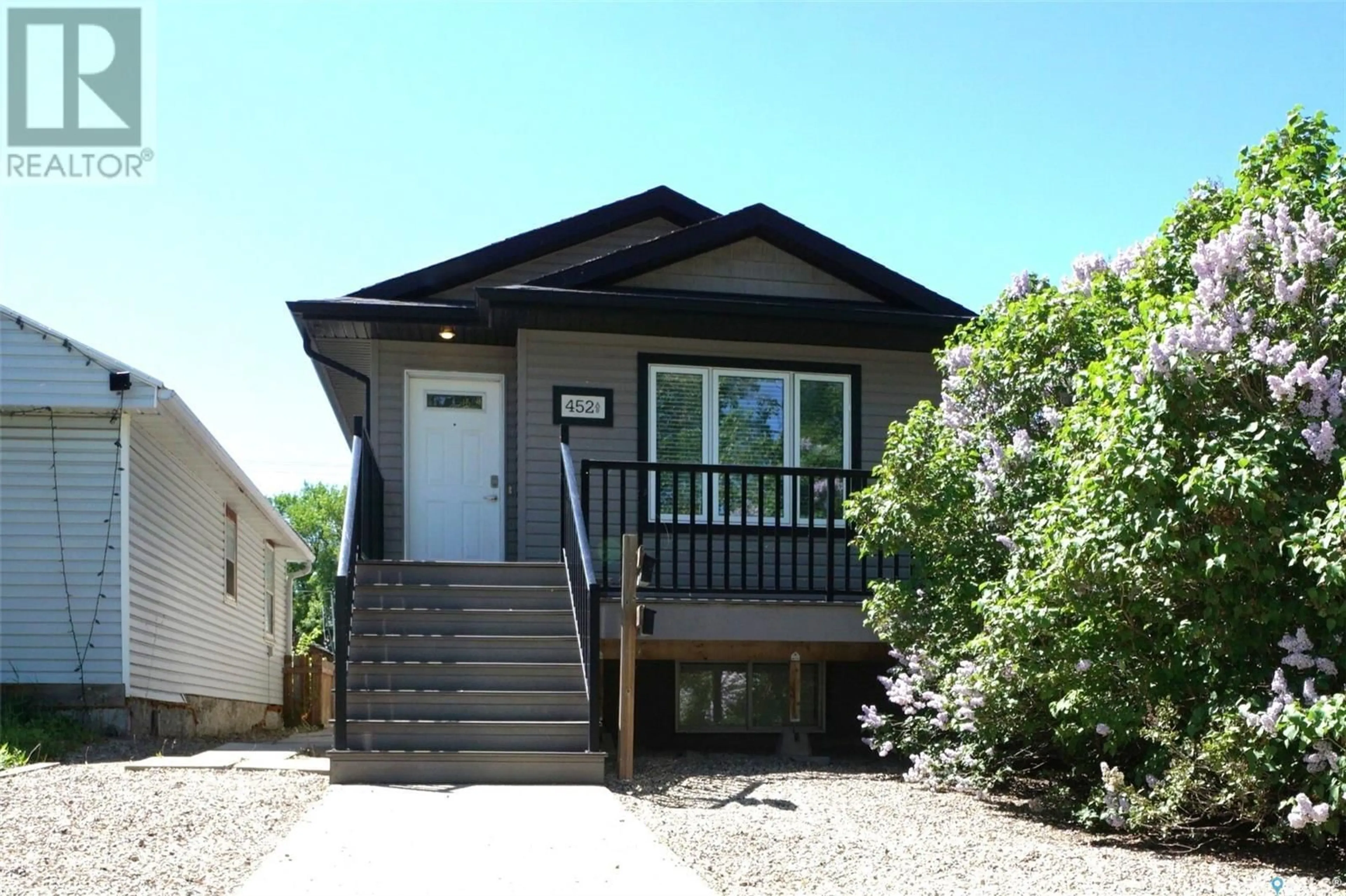 Home with vinyl exterior material, street for 452 HALIFAX STREET, Regina Saskatchewan S4R1T3