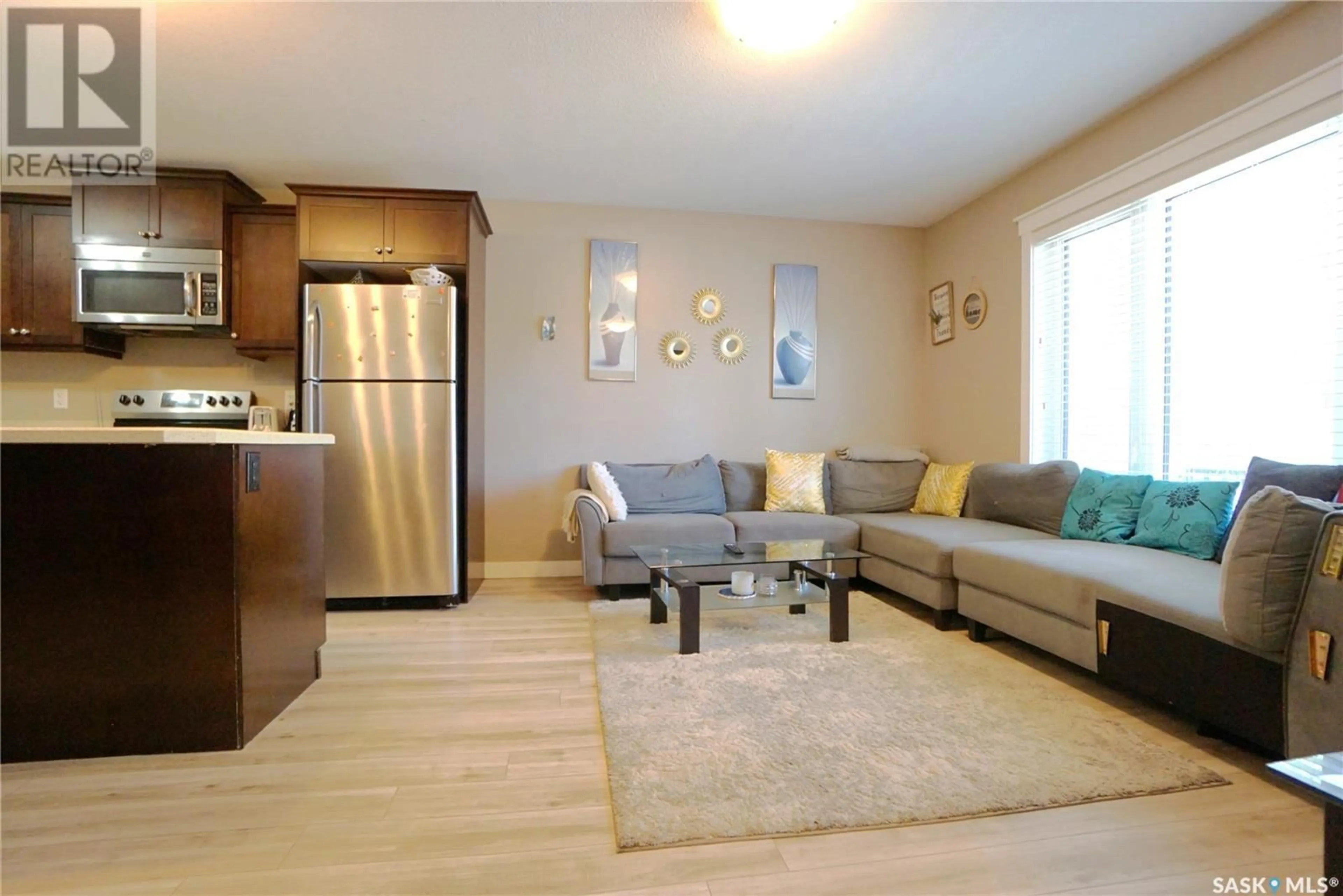 Living room with furniture, wood/laminate floor for 452 HALIFAX STREET, Regina Saskatchewan S4R1T3