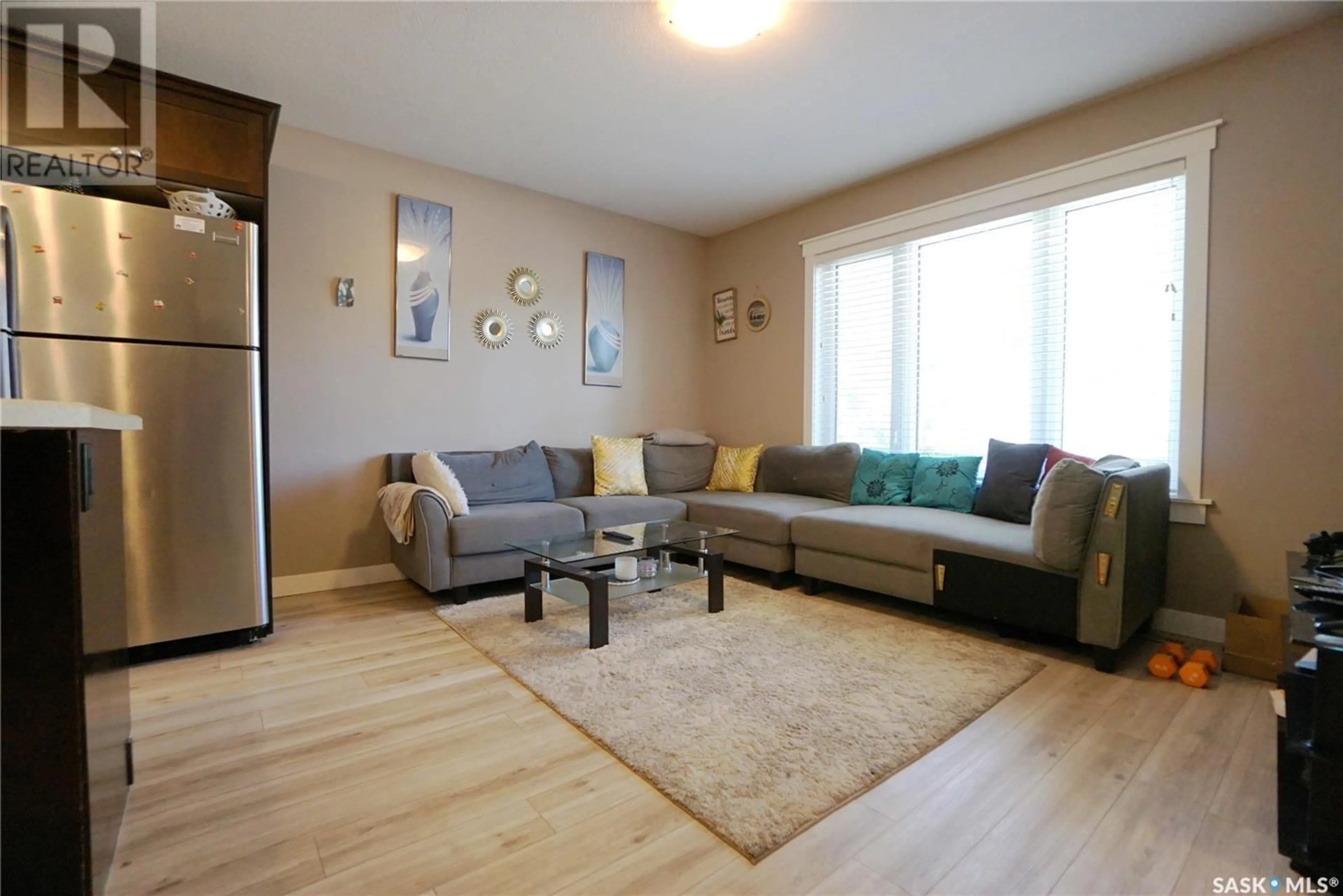 Living room with furniture, wood/laminate floor for 452 HALIFAX STREET, Regina Saskatchewan S4R1T3