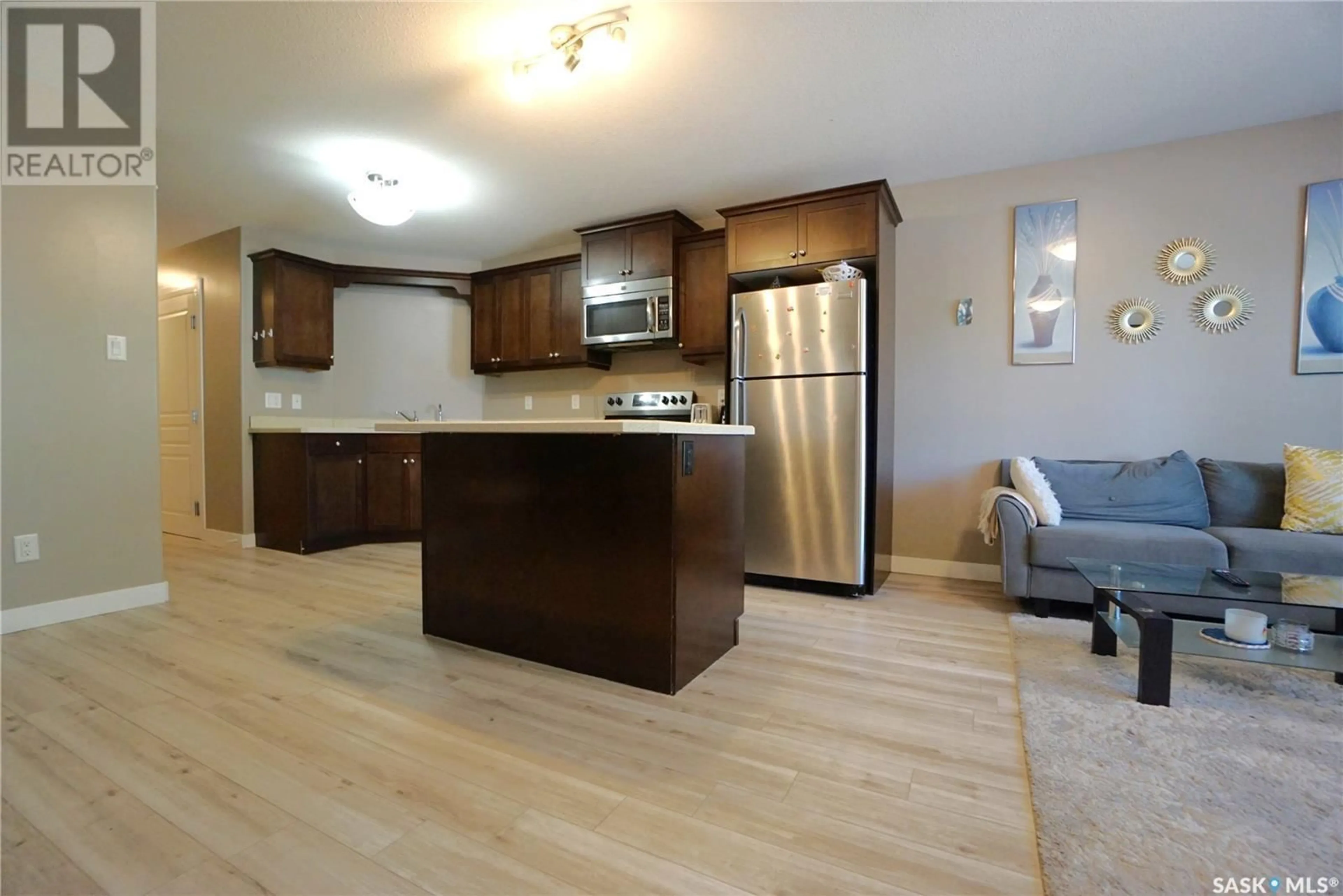Open concept kitchen, wood/laminate floor for 452 HALIFAX STREET, Regina Saskatchewan S4R1T3