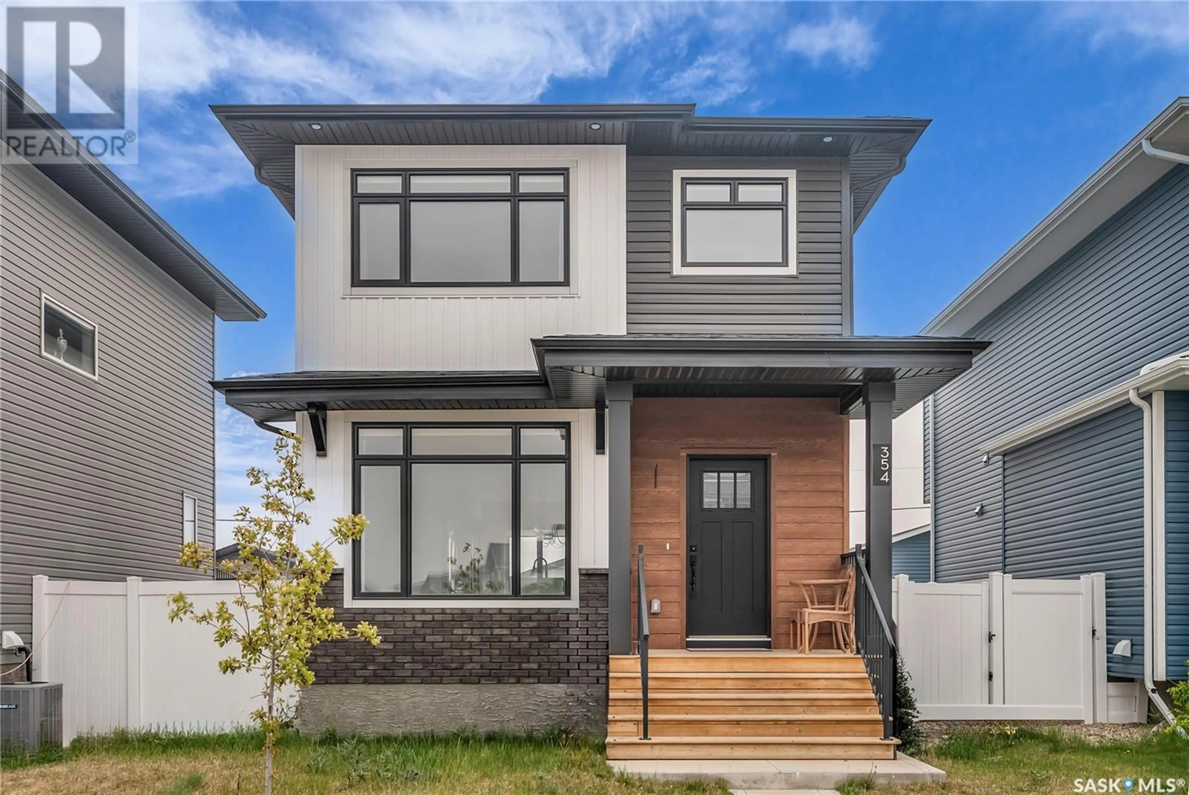 Home with brick exterior material, street for 354 KENASCHUK LANE, Saskatoon Saskatchewan S7W0Y5