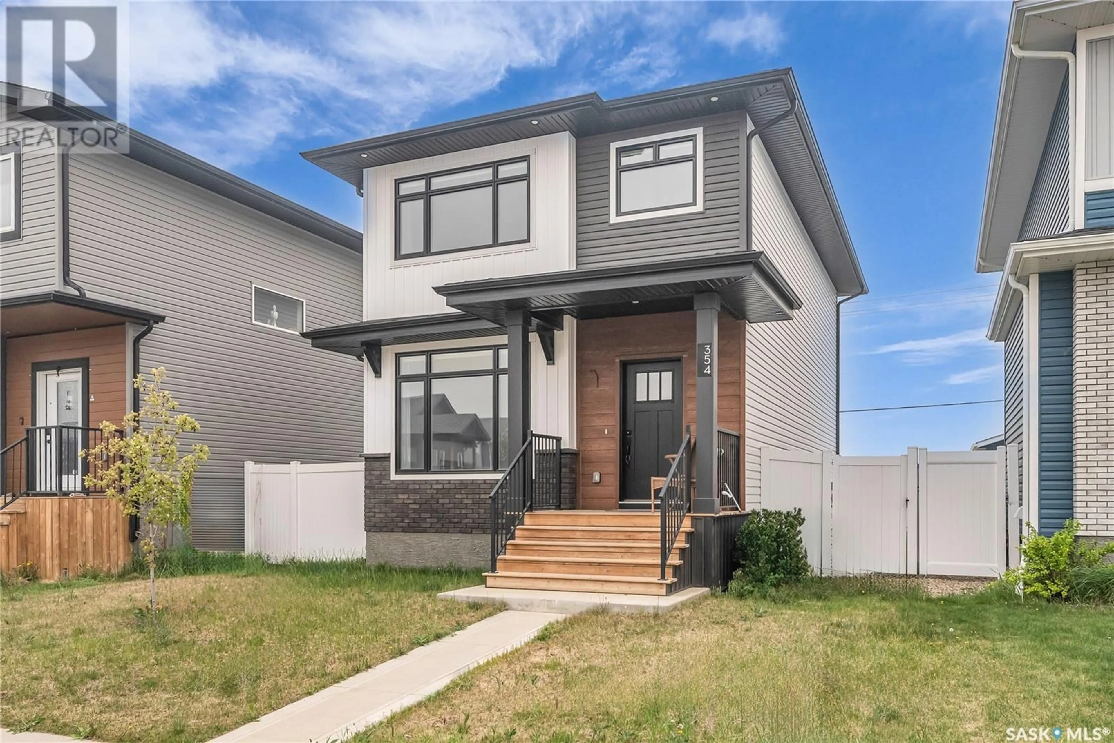 Home with brick exterior material, street for 354 KENASCHUK LANE, Saskatoon Saskatchewan S7W0Y5
