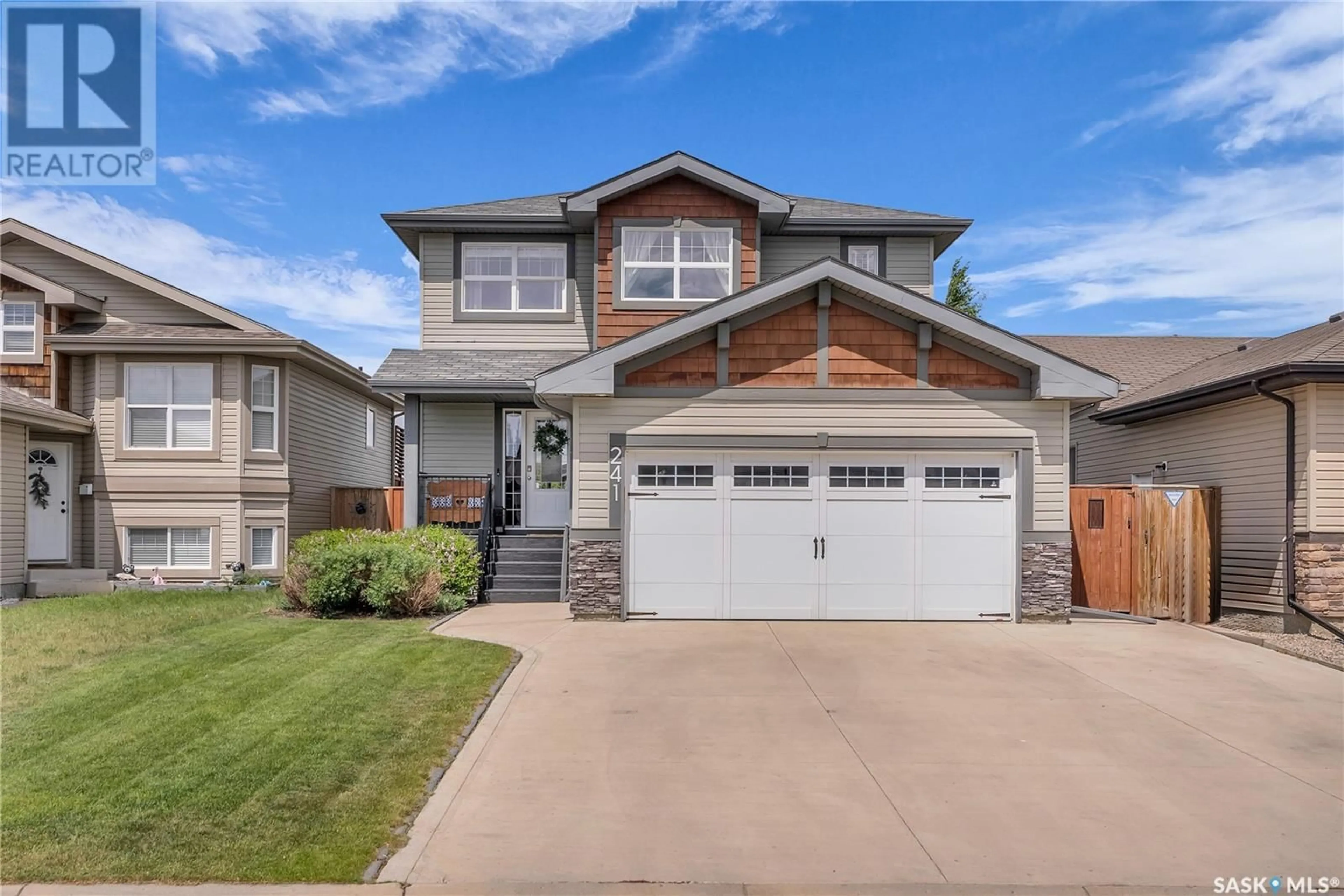 Home with vinyl exterior material, street for 241 ENNS CRESCENT, Martensville Saskatchewan S0K0A2