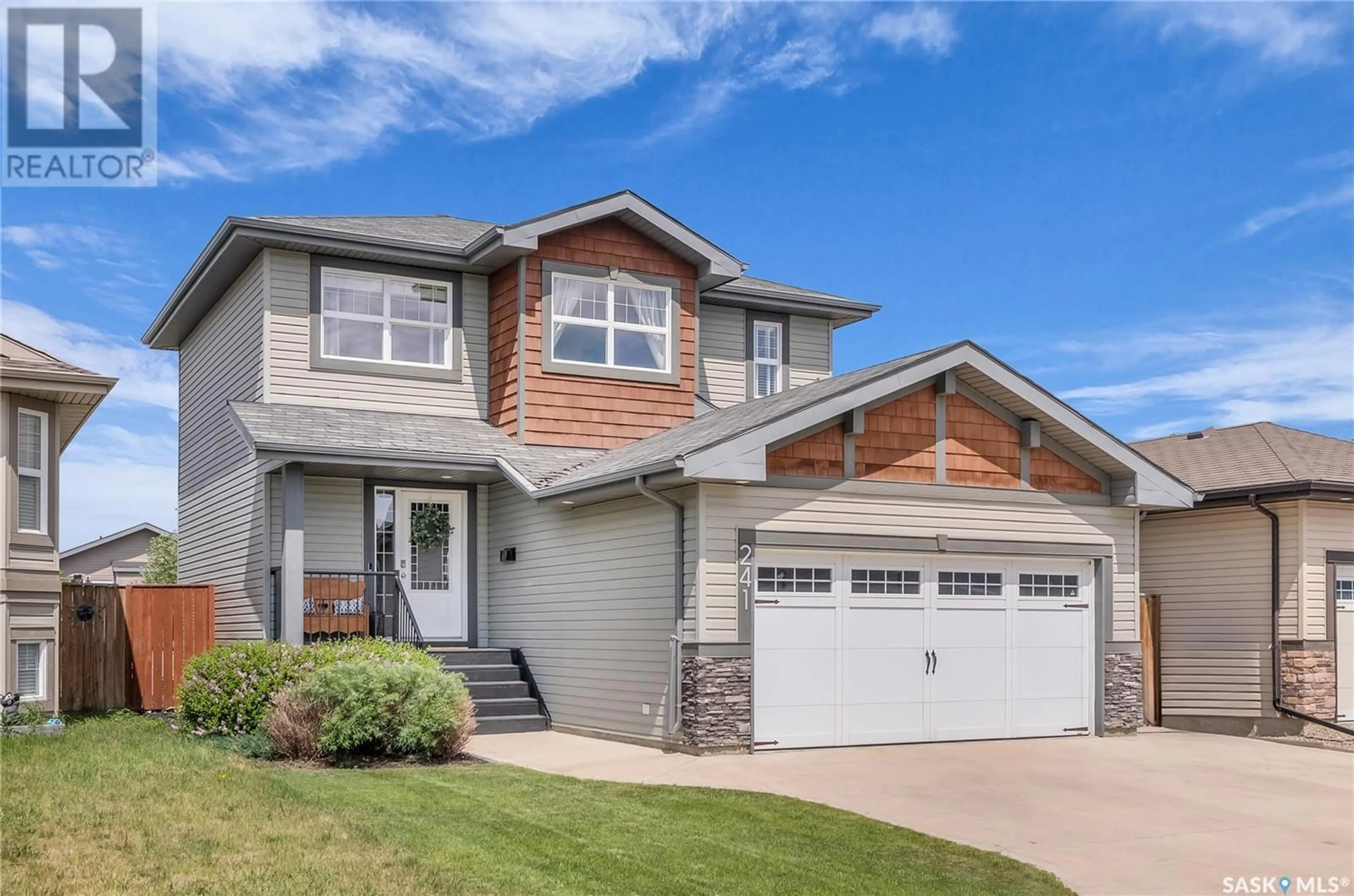 Home with vinyl exterior material, street for 241 ENNS CRESCENT, Martensville Saskatchewan S0K0A2