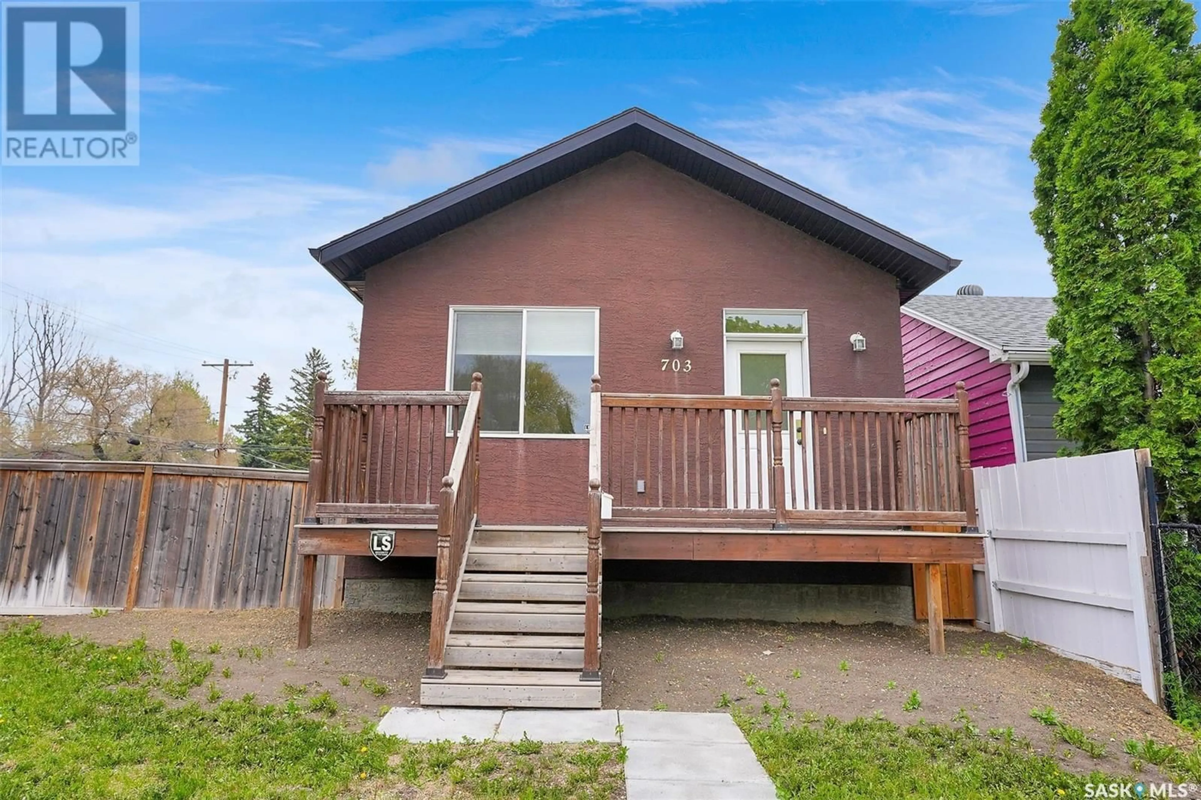Home with vinyl exterior material, street for 703 WASCANA STREET, Regina Saskatchewan S4T4H6