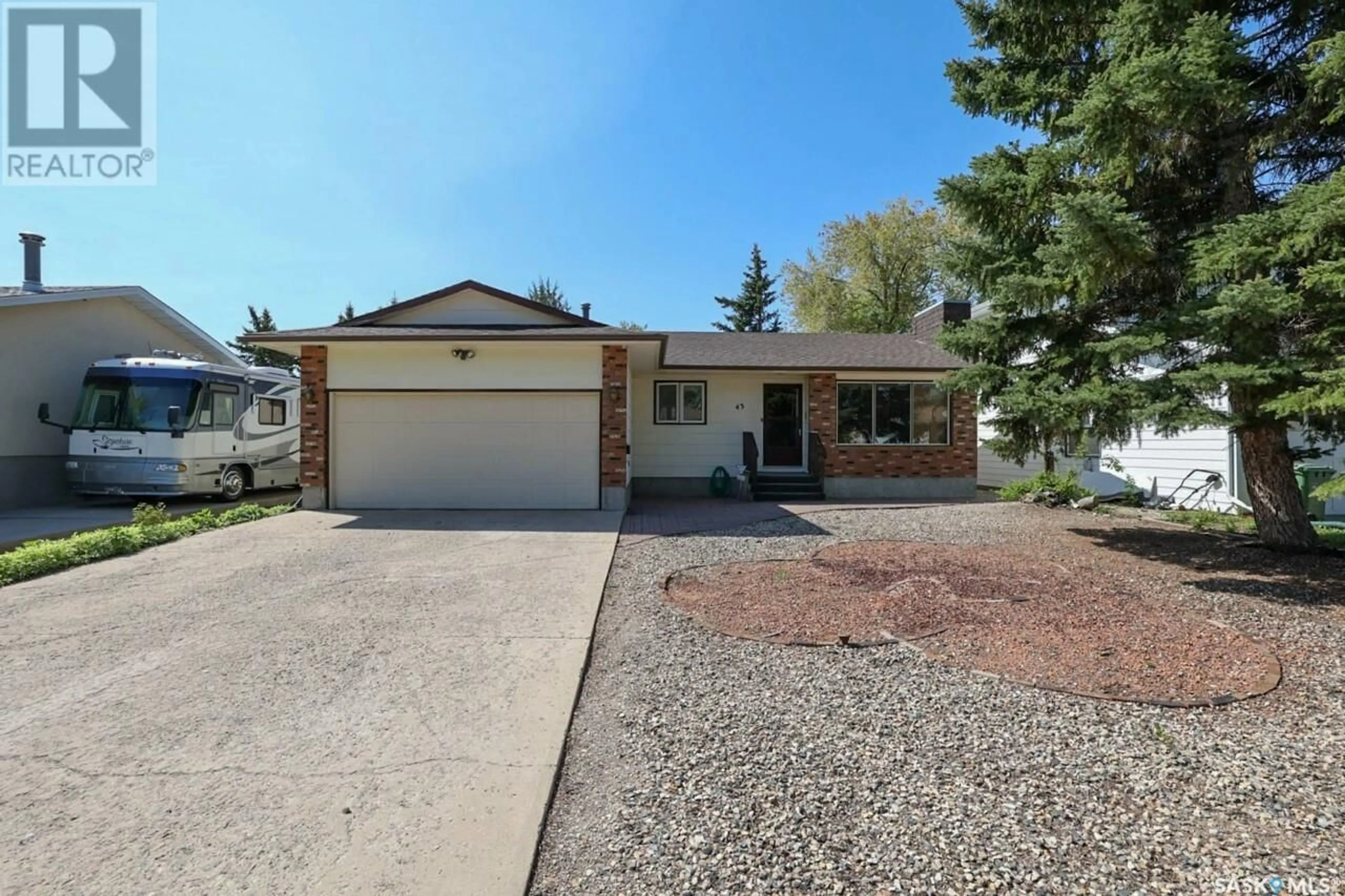 Home with vinyl exterior material, street for 43 HAWKES AVENUE, Regina Saskatchewan S4X1B3