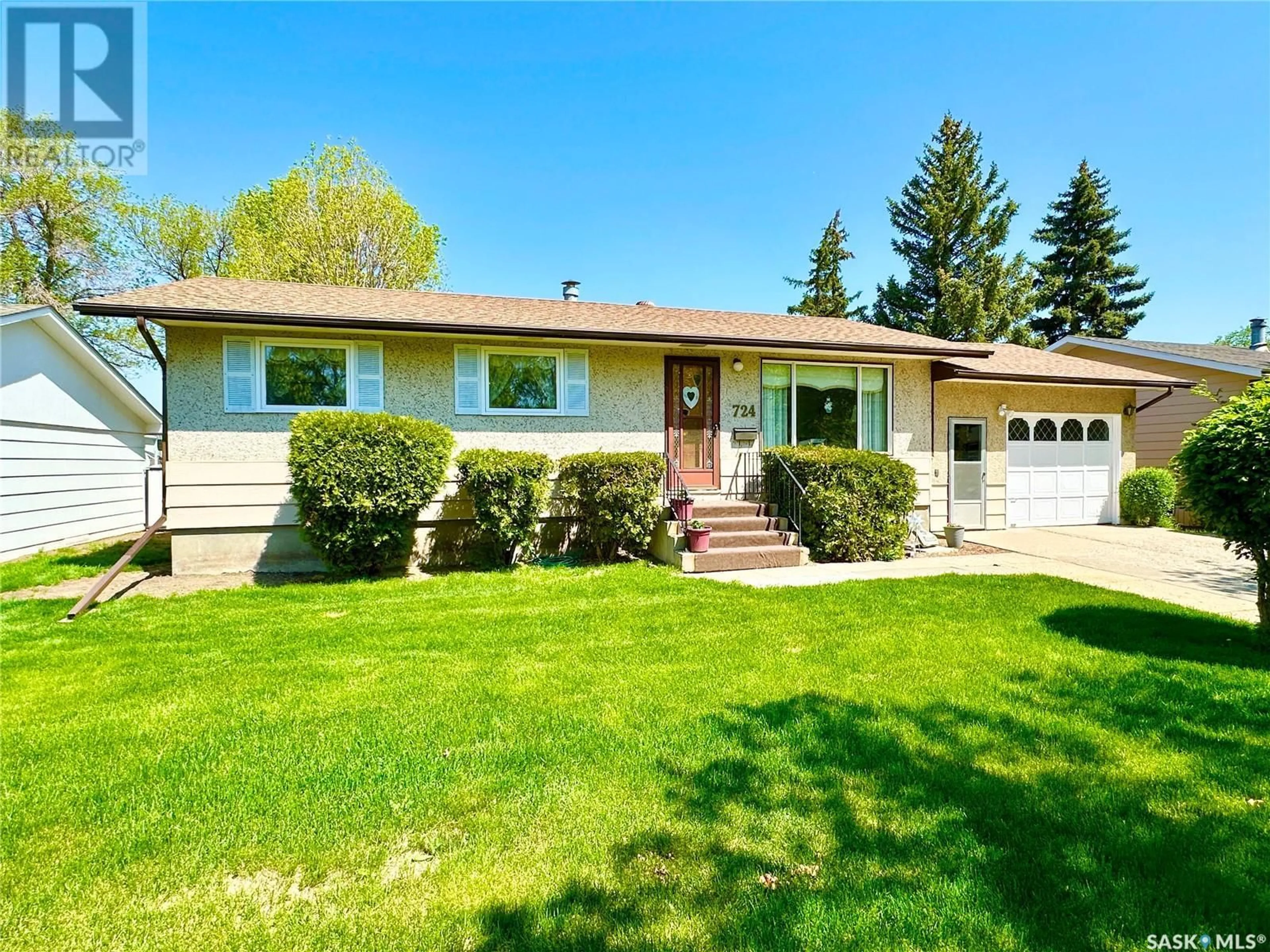Home with vinyl exterior material, street for 724 ELM CRESCENT, Weyburn Saskatchewan S4H0S7