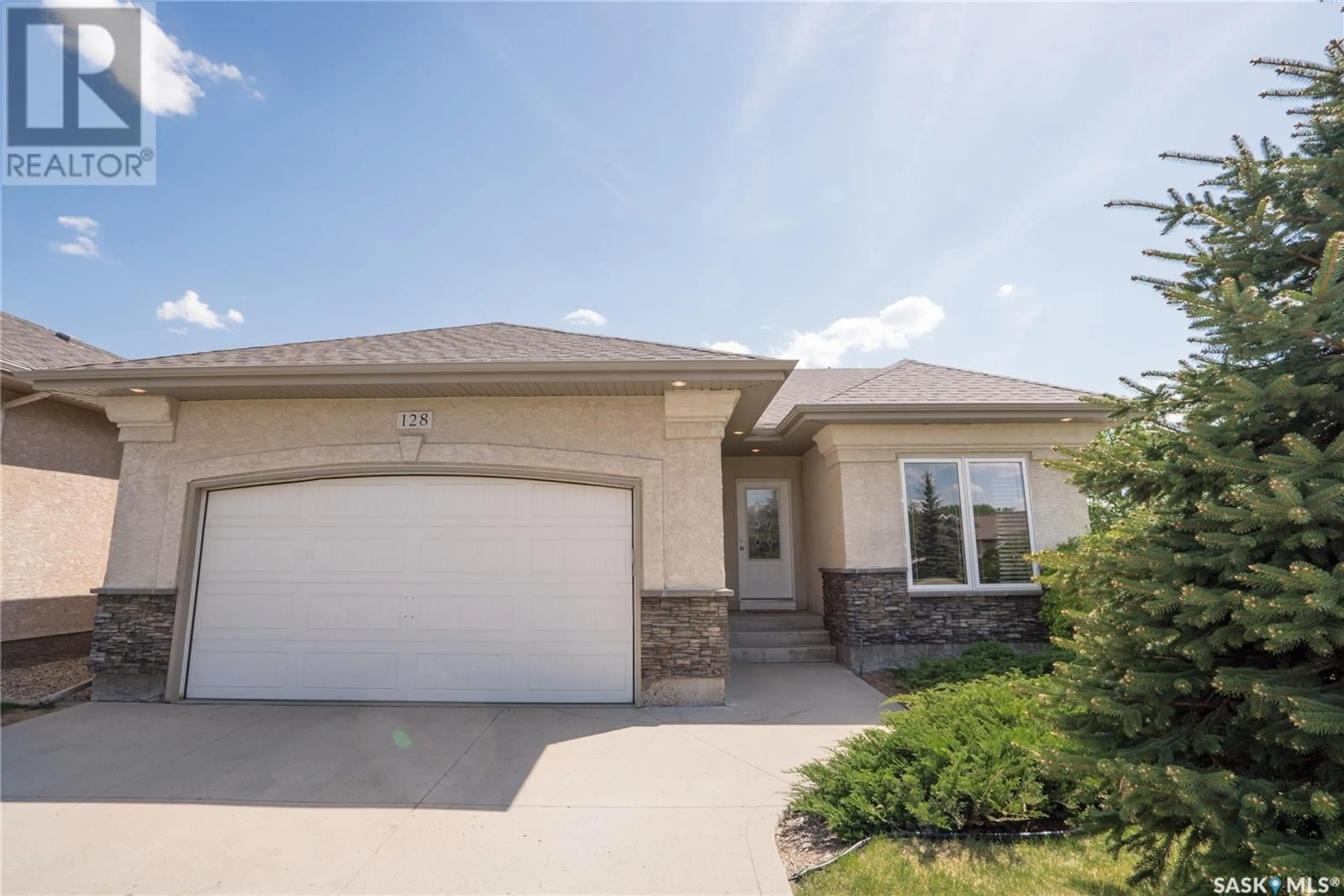 Home with vinyl exterior material, street for 128 201 CARTWRIGHT TERRACE, Saskatoon Saskatchewan S7T0A4