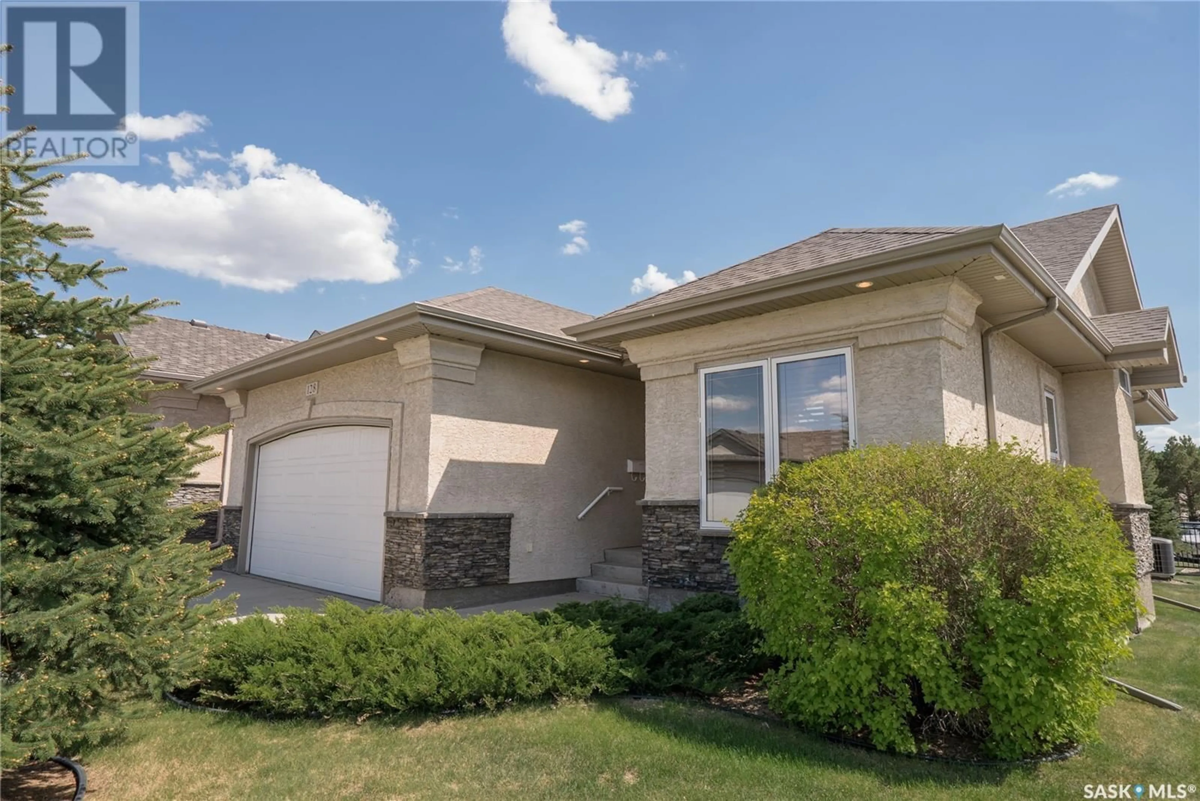 Home with vinyl exterior material, street for 128 201 CARTWRIGHT TERRACE, Saskatoon Saskatchewan S7T0A4
