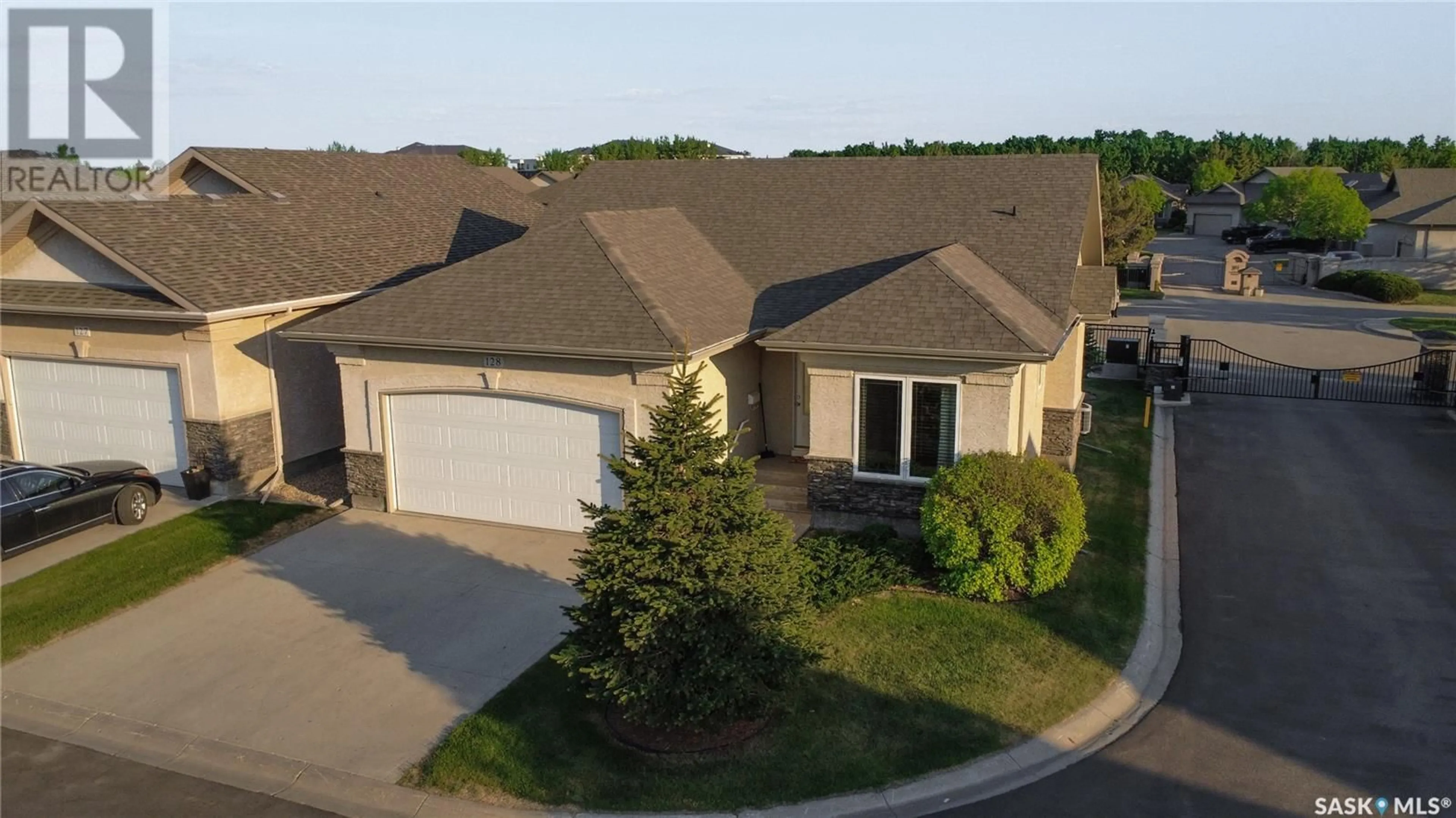 A pic from outside/outdoor area/front of a property/back of a property/a pic from drone, street for 128 201 CARTWRIGHT TERRACE, Saskatoon Saskatchewan S7T0A4