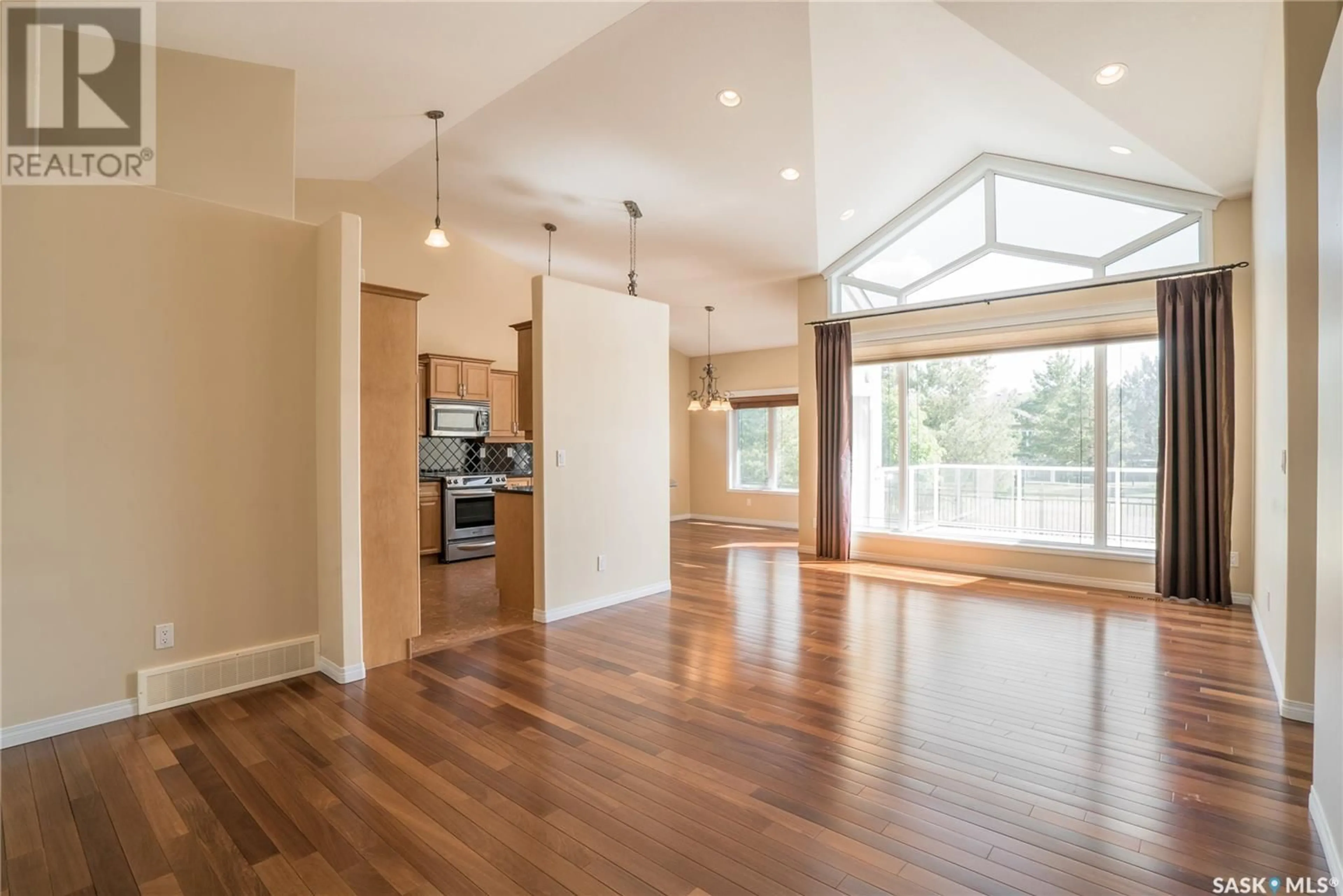 Open concept kitchen, wood/laminate floor for 128 201 CARTWRIGHT TERRACE, Saskatoon Saskatchewan S7T0A4