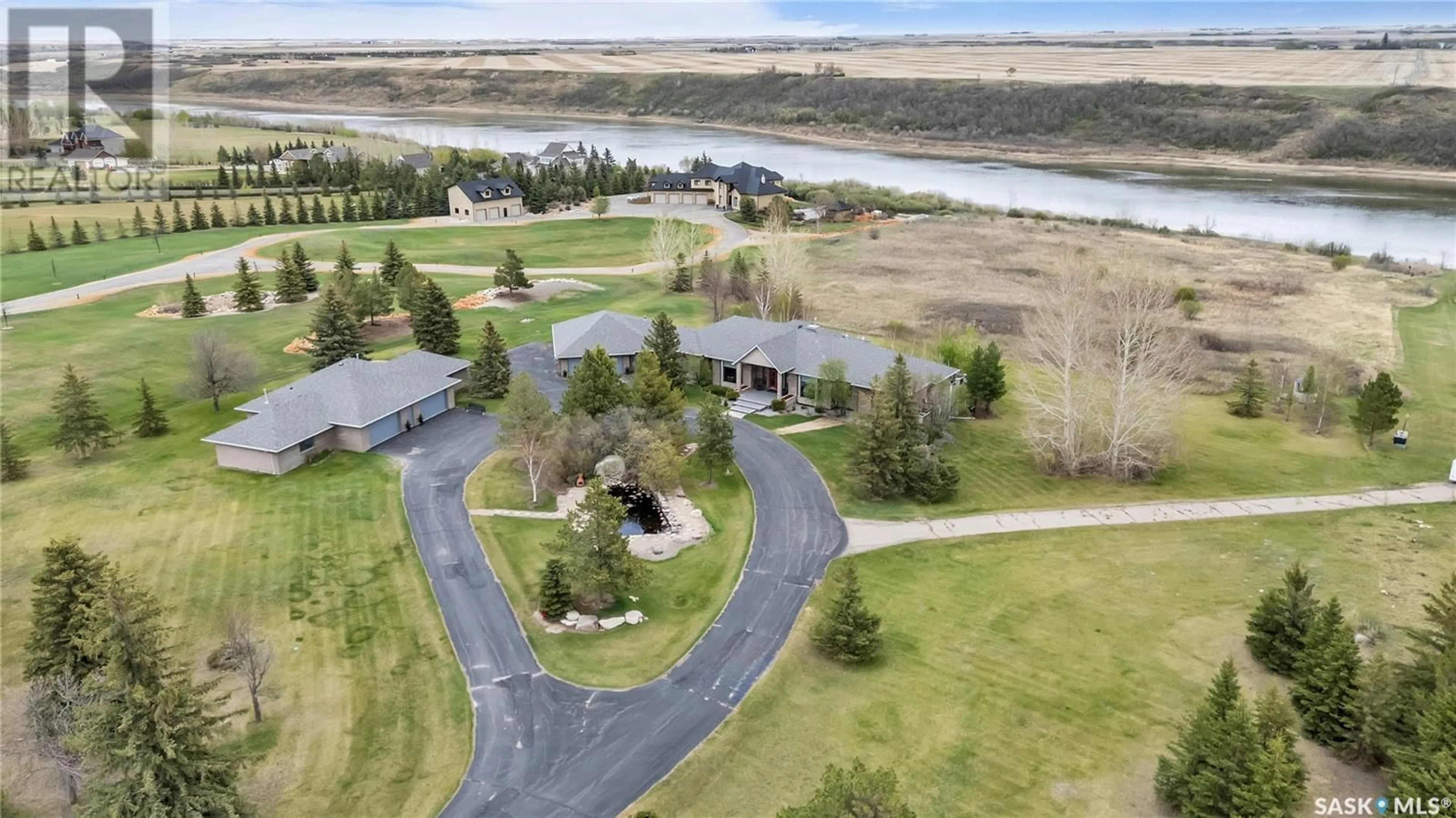 A pic from outside/outdoor area/front of a property/back of a property/a pic from drone, water/lake/river/ocean view for 48 CATHEDRAL BLUFFS ROAD, Corman Park Rm No. 344 Saskatchewan S7P1A1