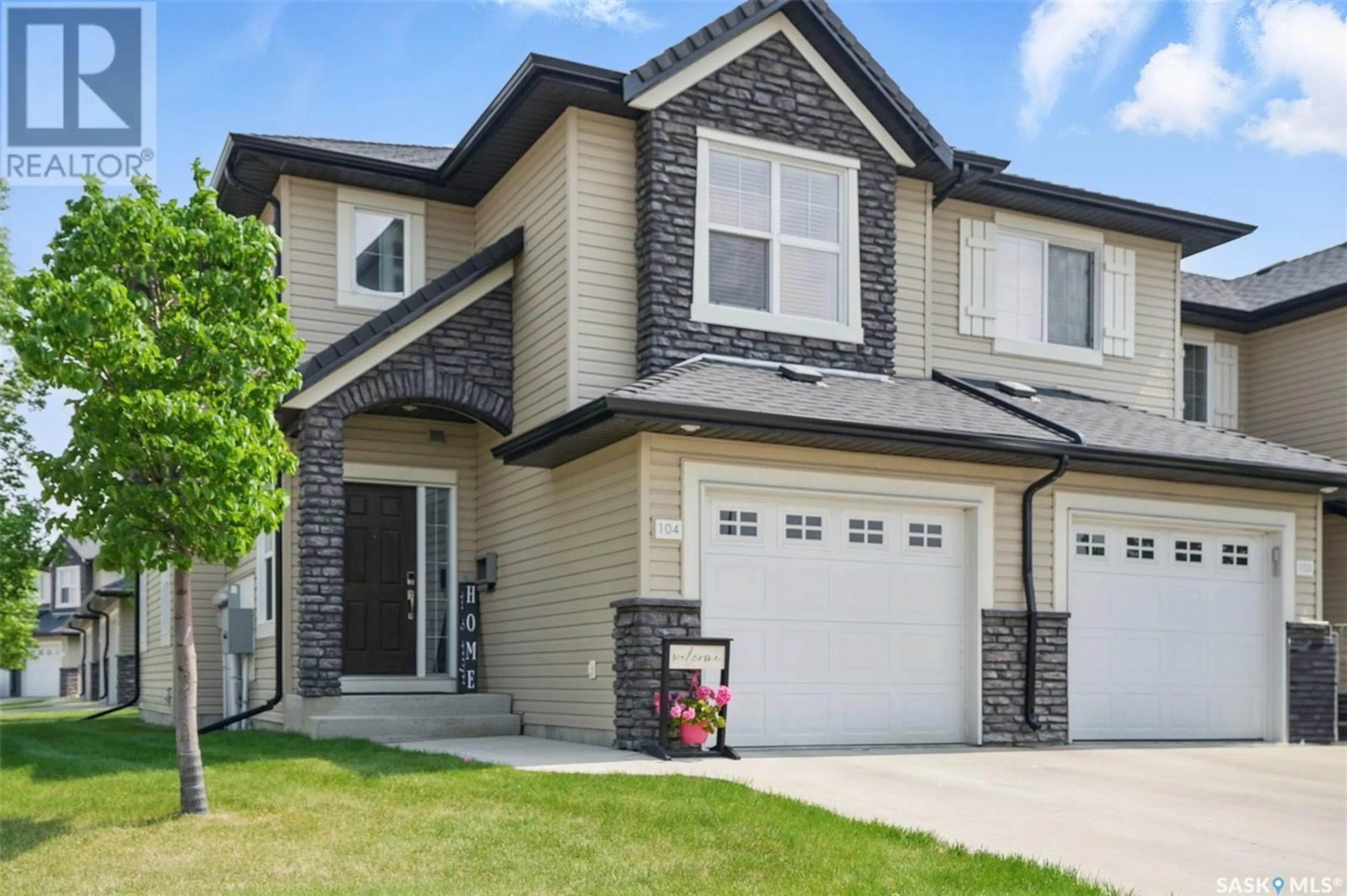 Home with vinyl exterior material, street for 410 - 104 LEDINGHAM WAY, Saskatoon Saskatchewan S7V0C4