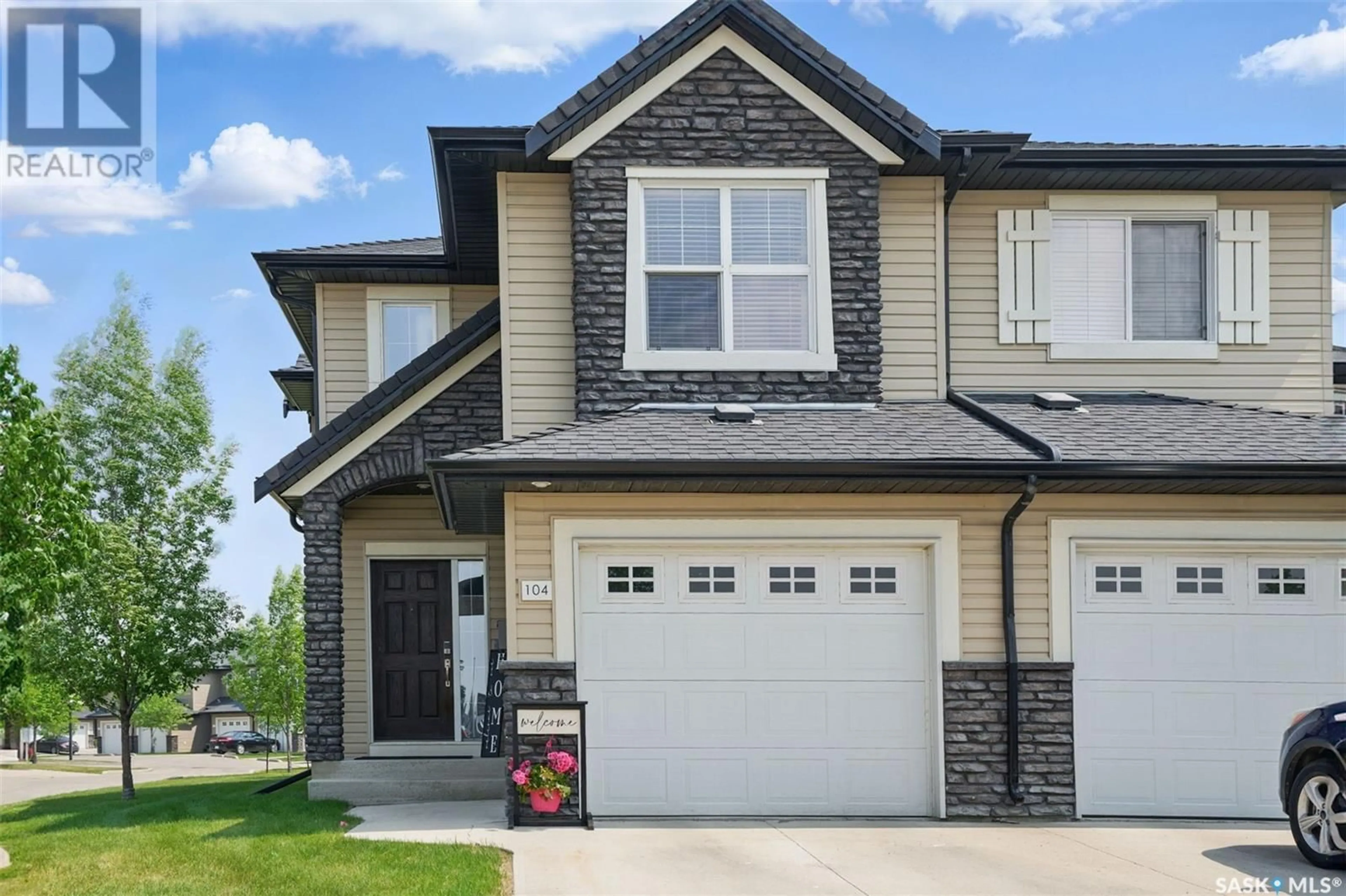 Home with vinyl exterior material, street for 410 - 104 LEDINGHAM WAY, Saskatoon Saskatchewan S7V0C4