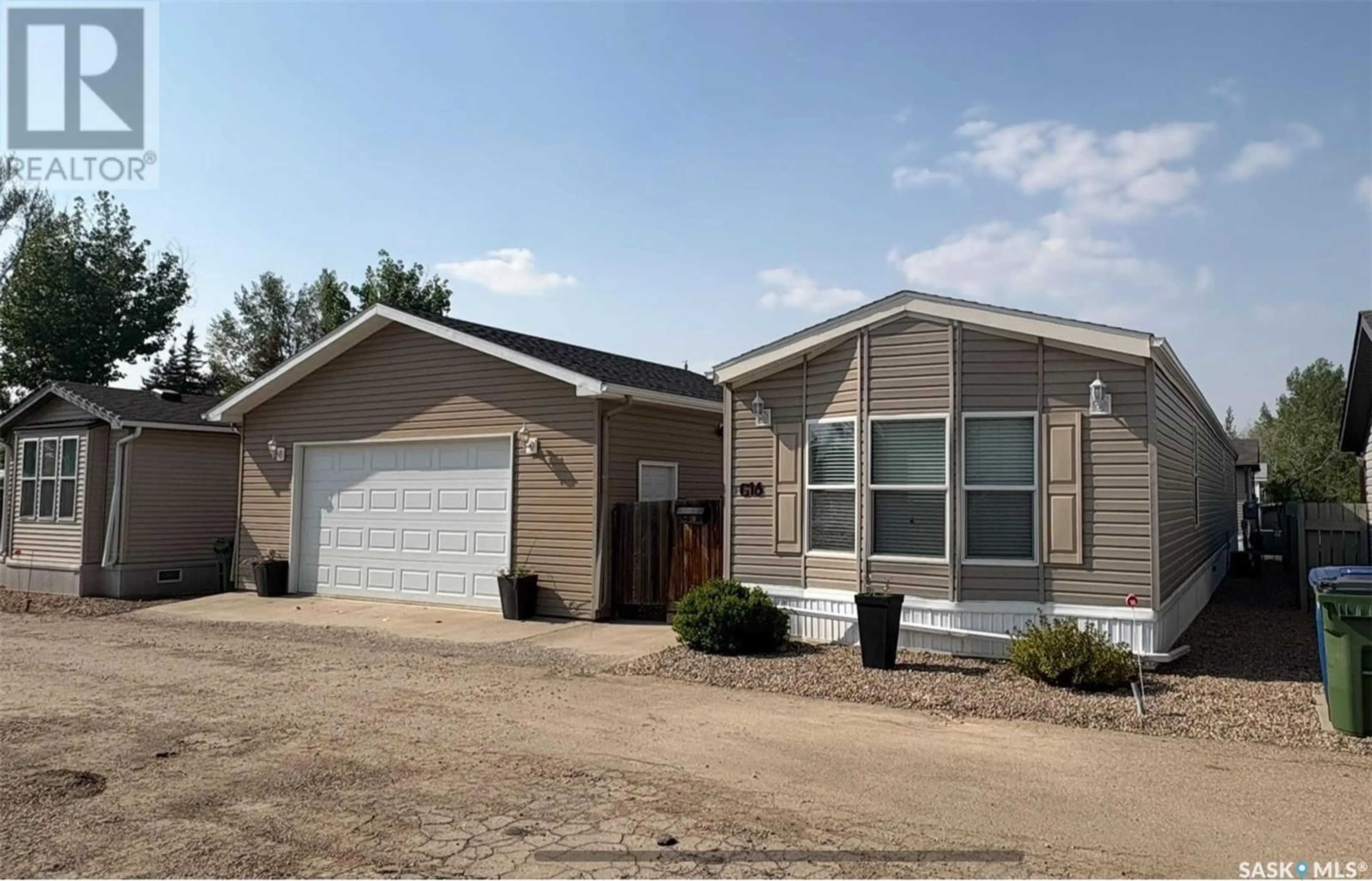 Home with vinyl exterior material, street for 1455 9TH AVENUE, Moose Jaw Saskatchewan S6J1C6