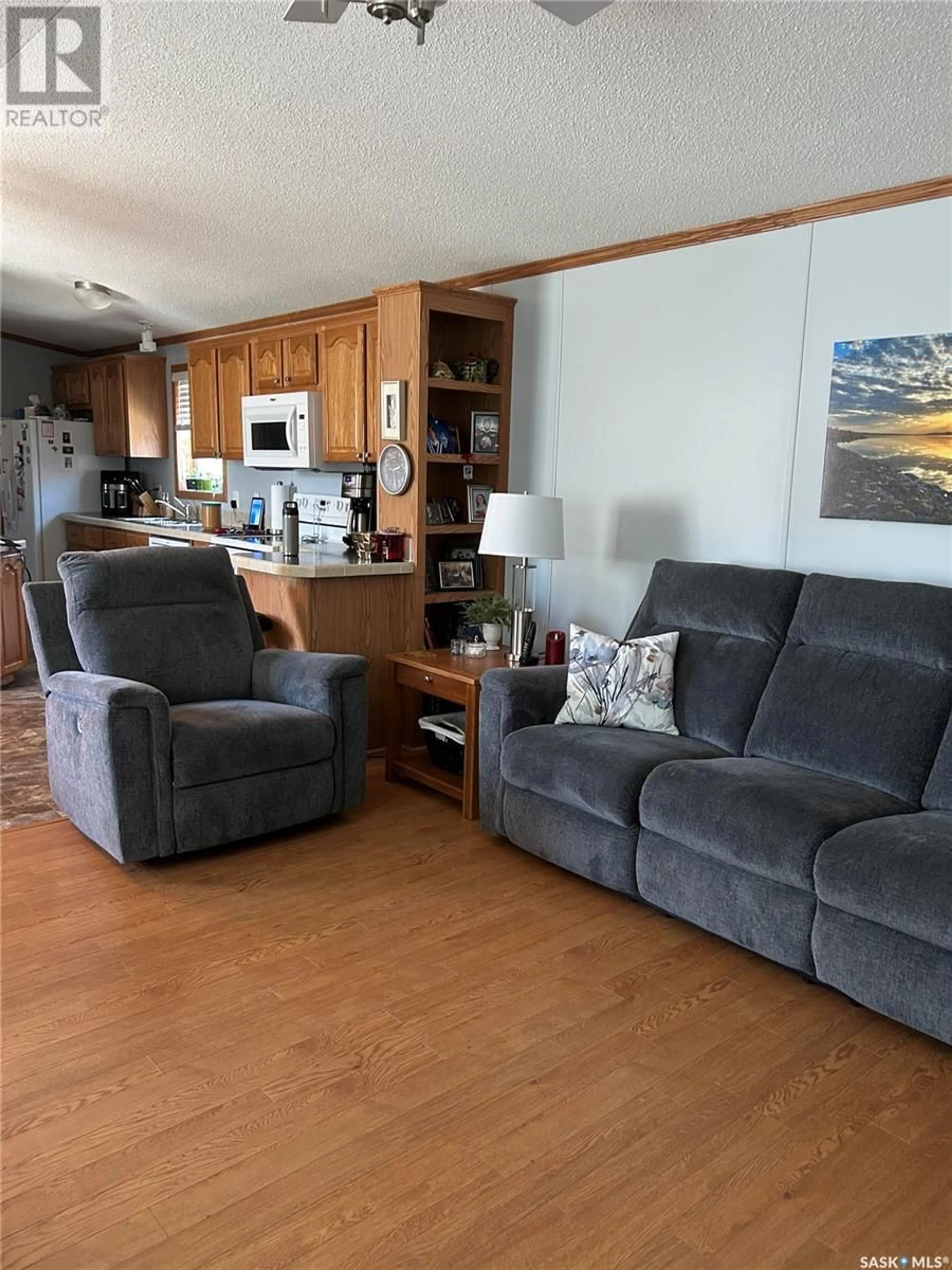 Living room with furniture, wood/laminate floor for 1455 9TH AVENUE, Moose Jaw Saskatchewan S6J1C6
