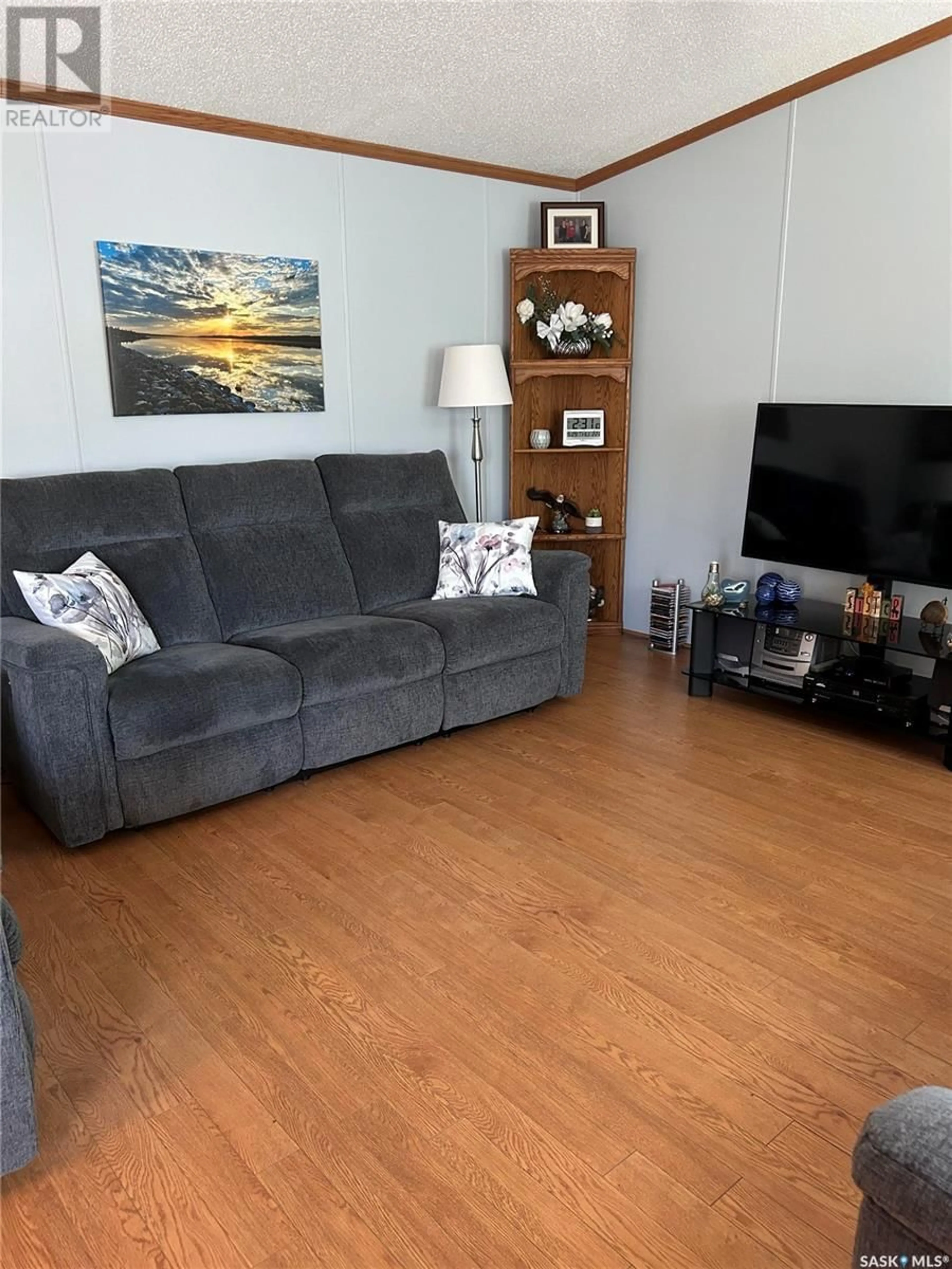 Living room with furniture, wood/laminate floor for 1455 9TH AVENUE, Moose Jaw Saskatchewan S6J1C6