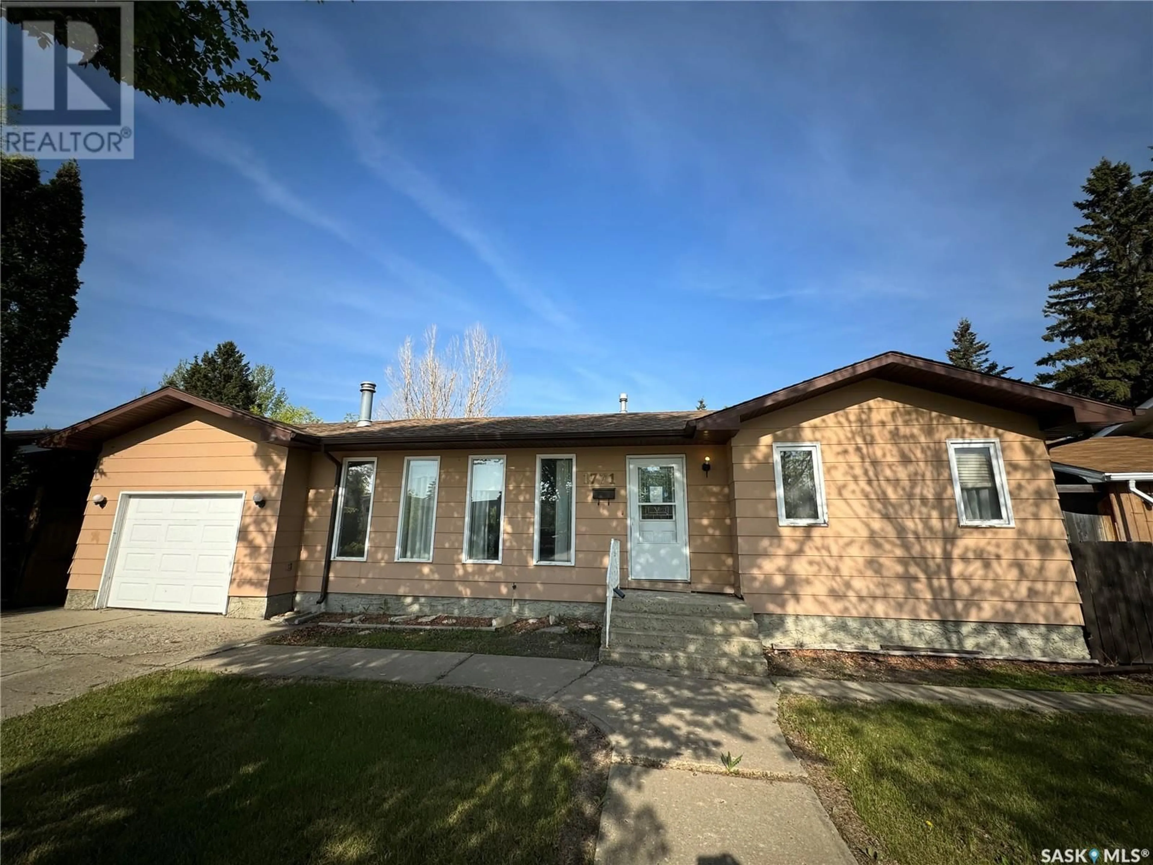 Home with brick exterior material, street for 1771 CENTENNIAL CRESCENT, North Battleford Saskatchewan S9A3J2