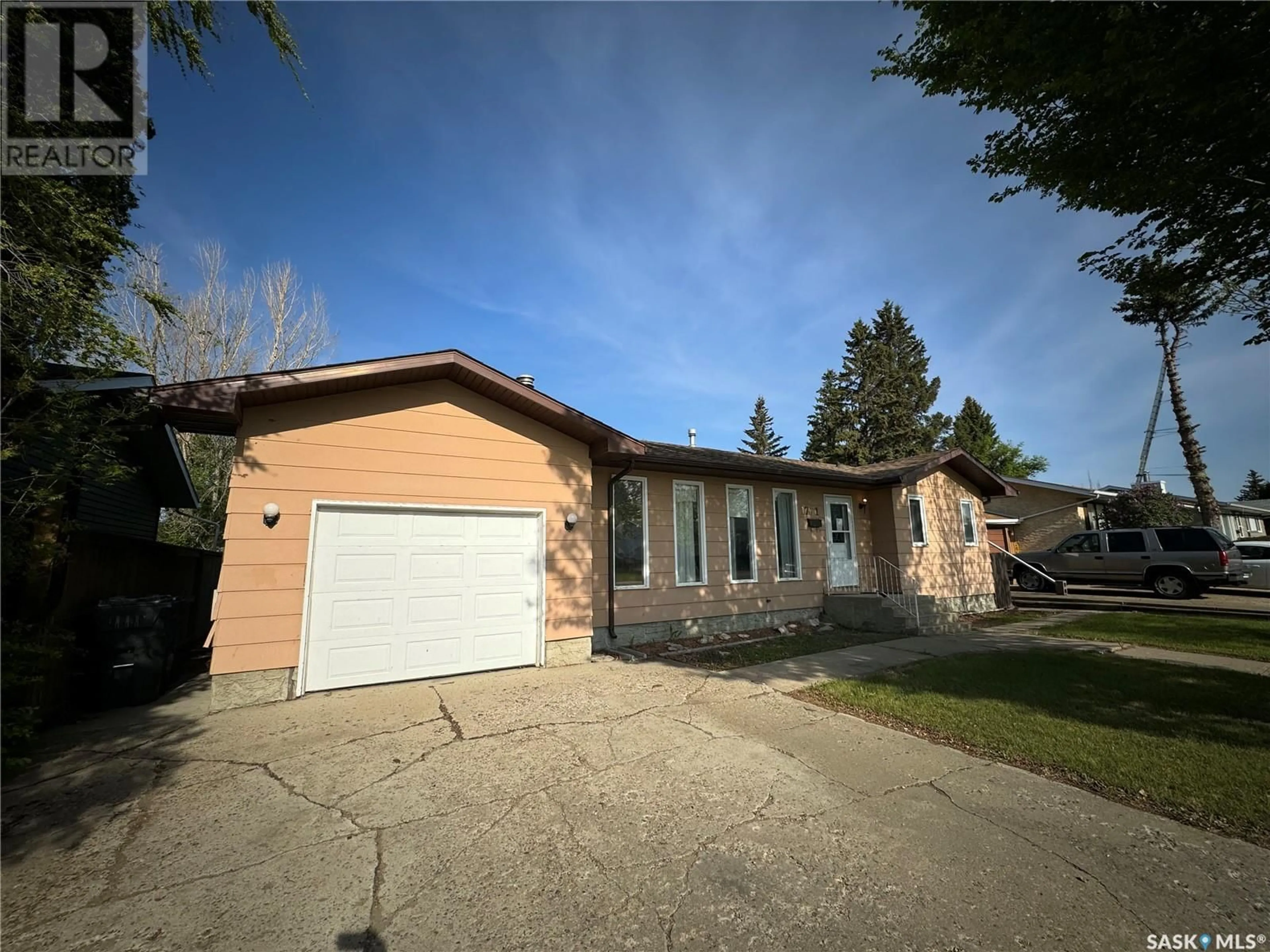 Home with brick exterior material, street for 1771 CENTENNIAL CRESCENT, North Battleford Saskatchewan S9A3J2