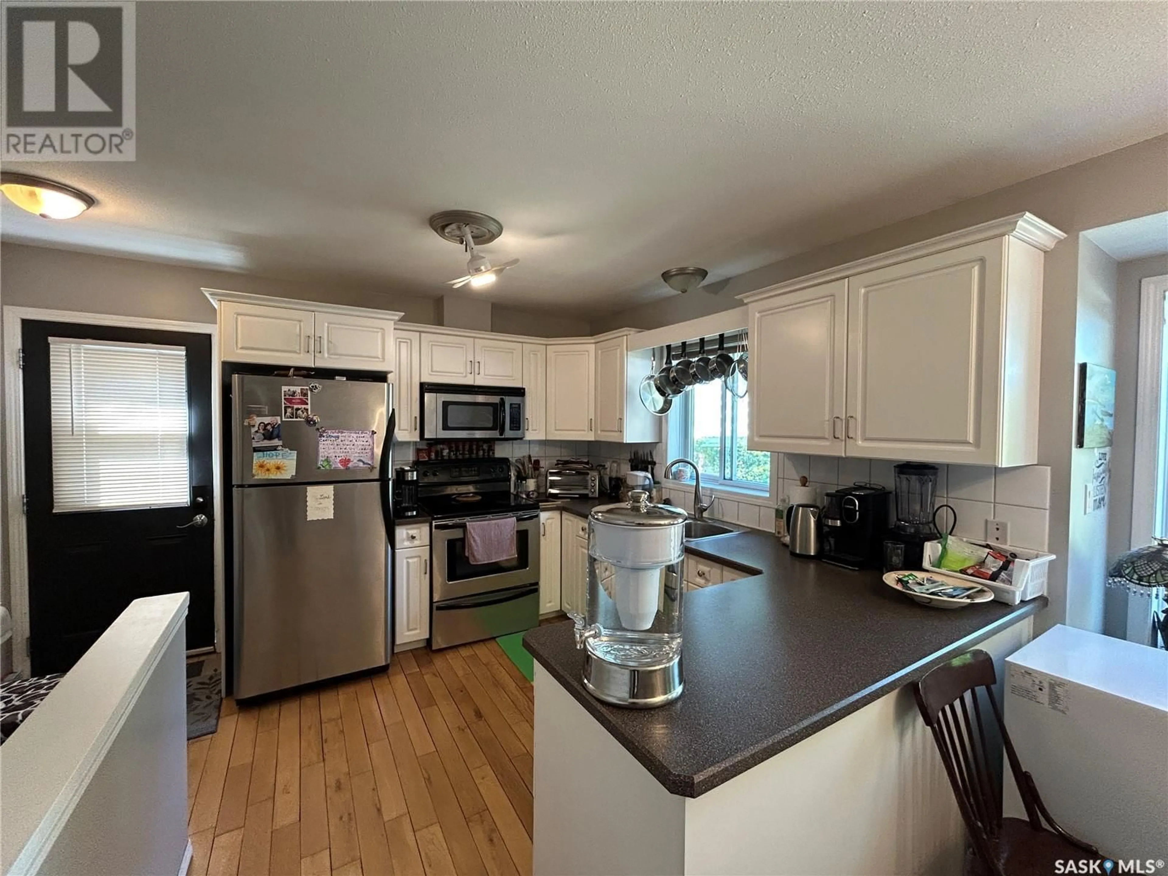 Open concept kitchen, wood/laminate floor for 3005 2ND AVENUE, Waldheim Saskatchewan S0K4R0