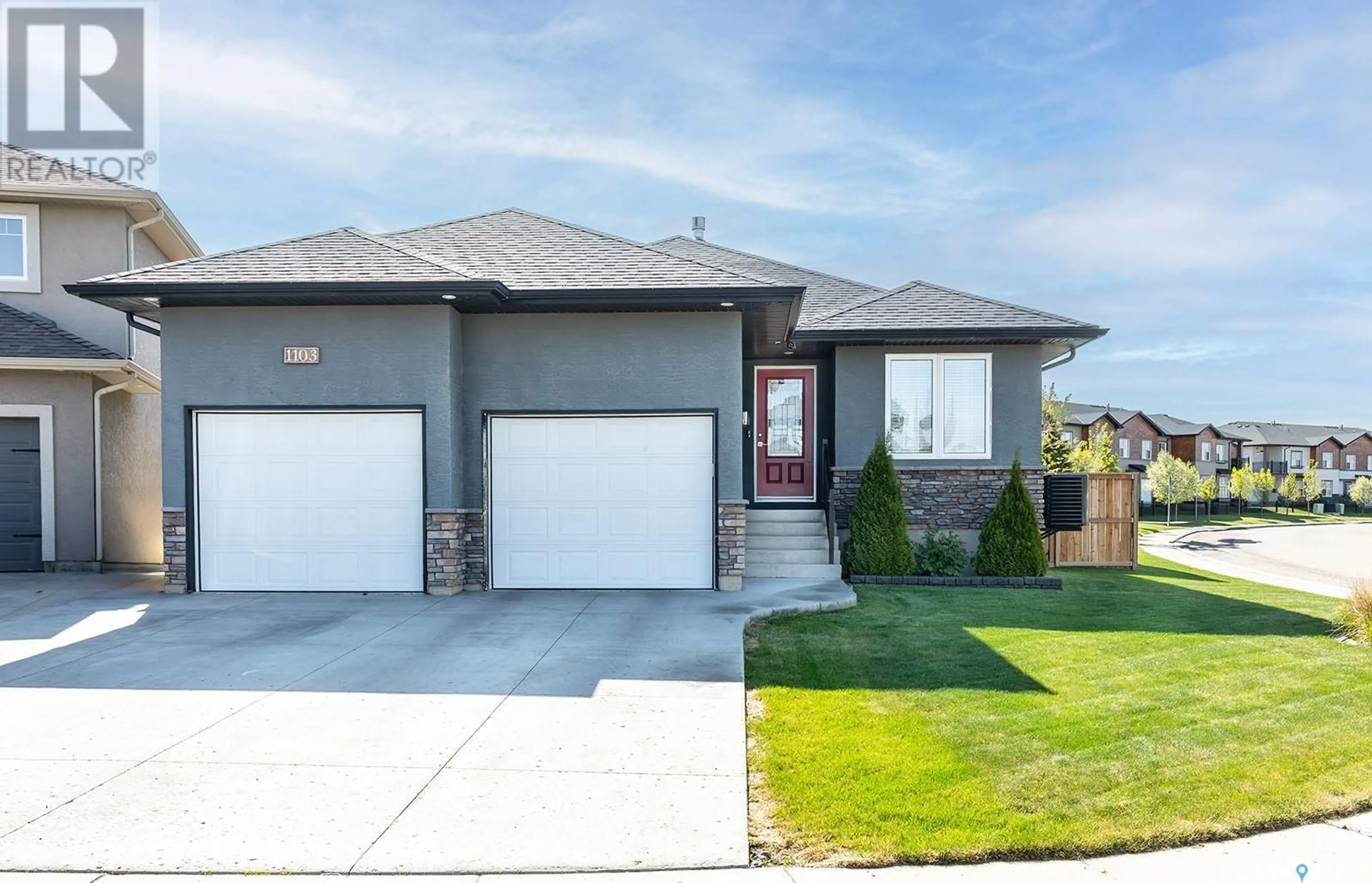 Home with vinyl exterior material, street for 1103 PATRICK TERRACE, Saskatoon Saskatchewan S7W0G2