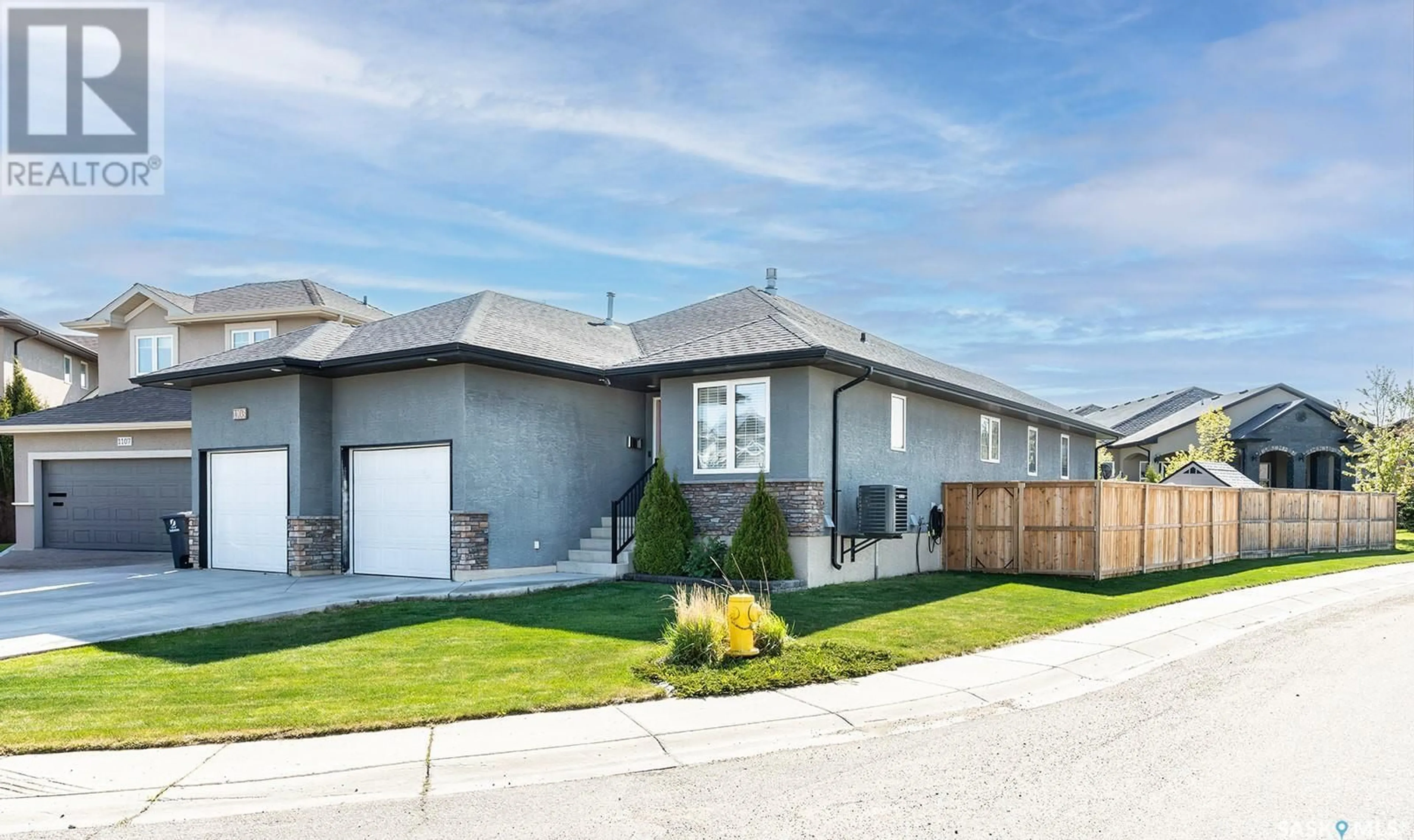 Home with vinyl exterior material, street for 1103 PATRICK TERRACE, Saskatoon Saskatchewan S7W0G2