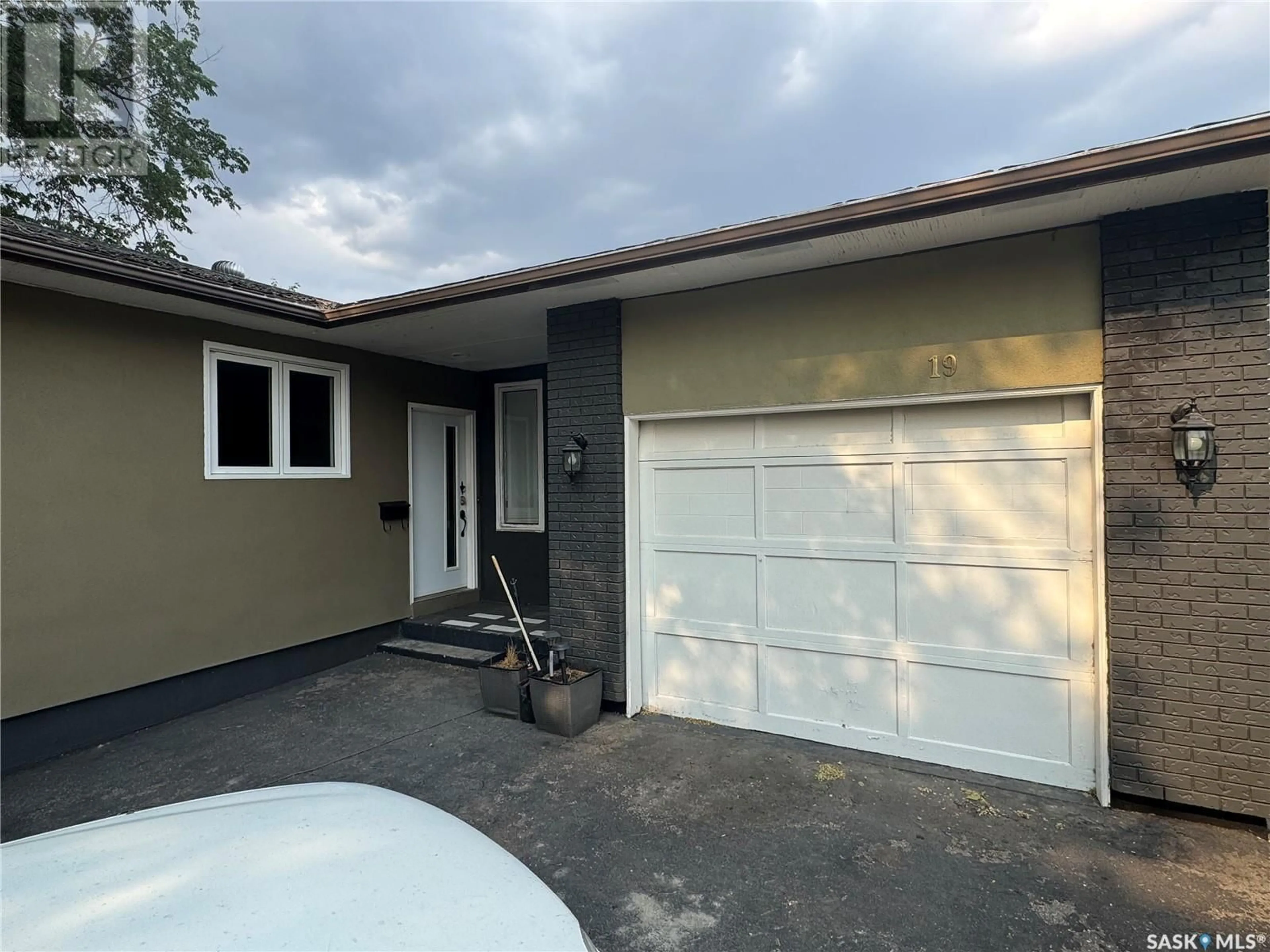 Home with vinyl exterior material, street for 19 BARR PLACE, Saskatoon Saskatchewan S7M4G1