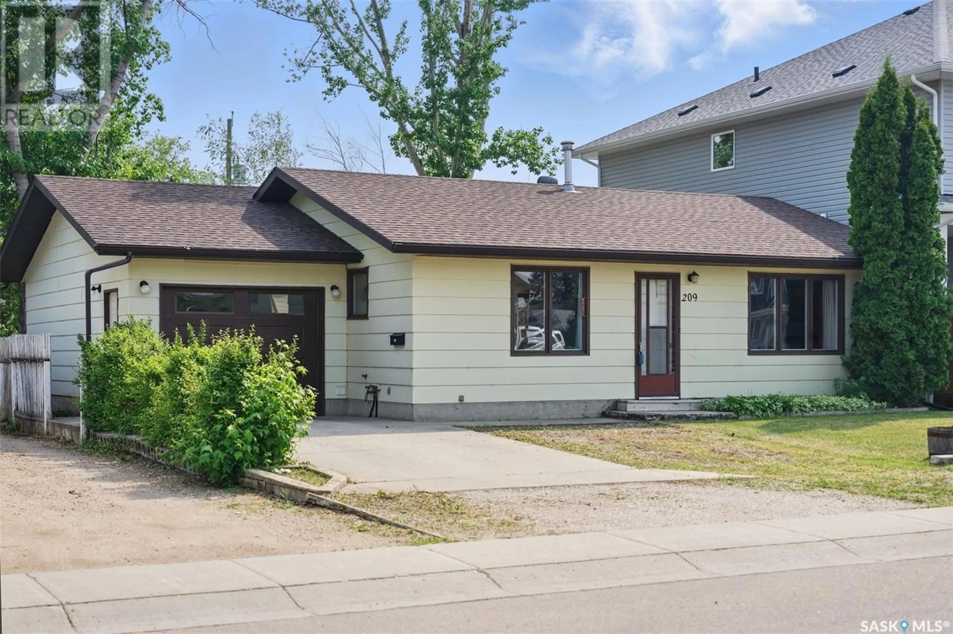 Home with vinyl exterior material, street for 209 4TH STREET, Warman Saskatchewan S0K4S0