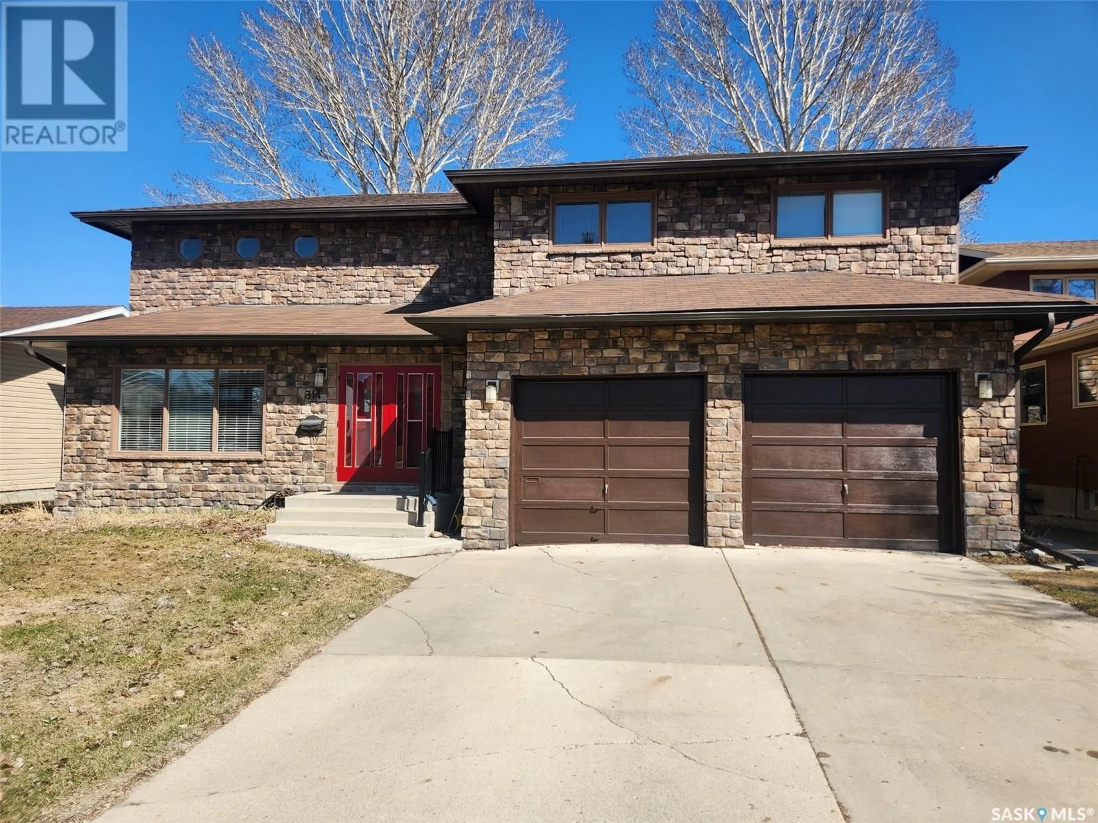 Home with brick exterior material, street for 314 DORE WAY, Saskatoon Saskatchewan S7K4X9
