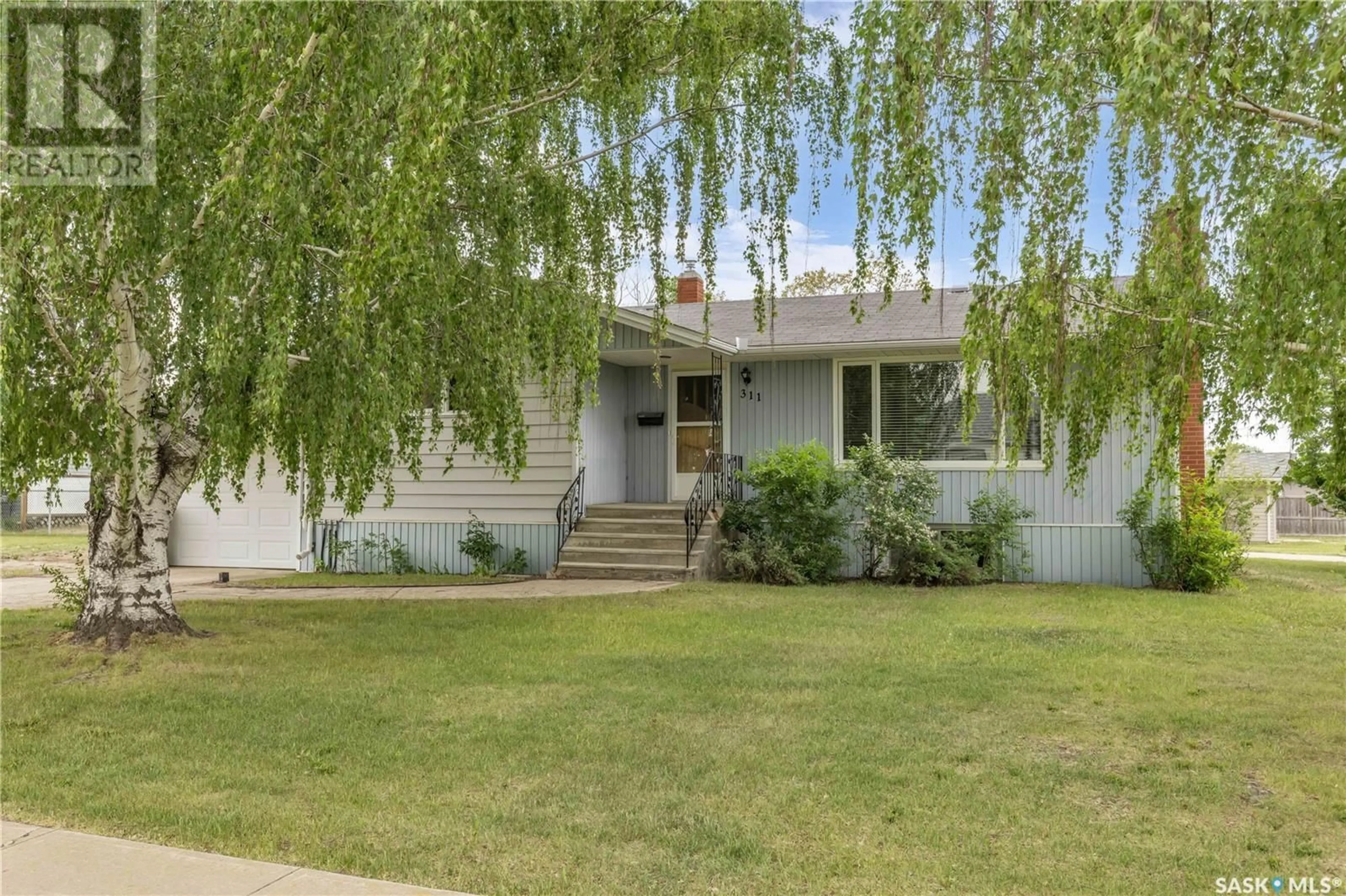 Home with vinyl exterior material, street for 311 1ST AVENUE, Hanley Saskatchewan S0G2E0