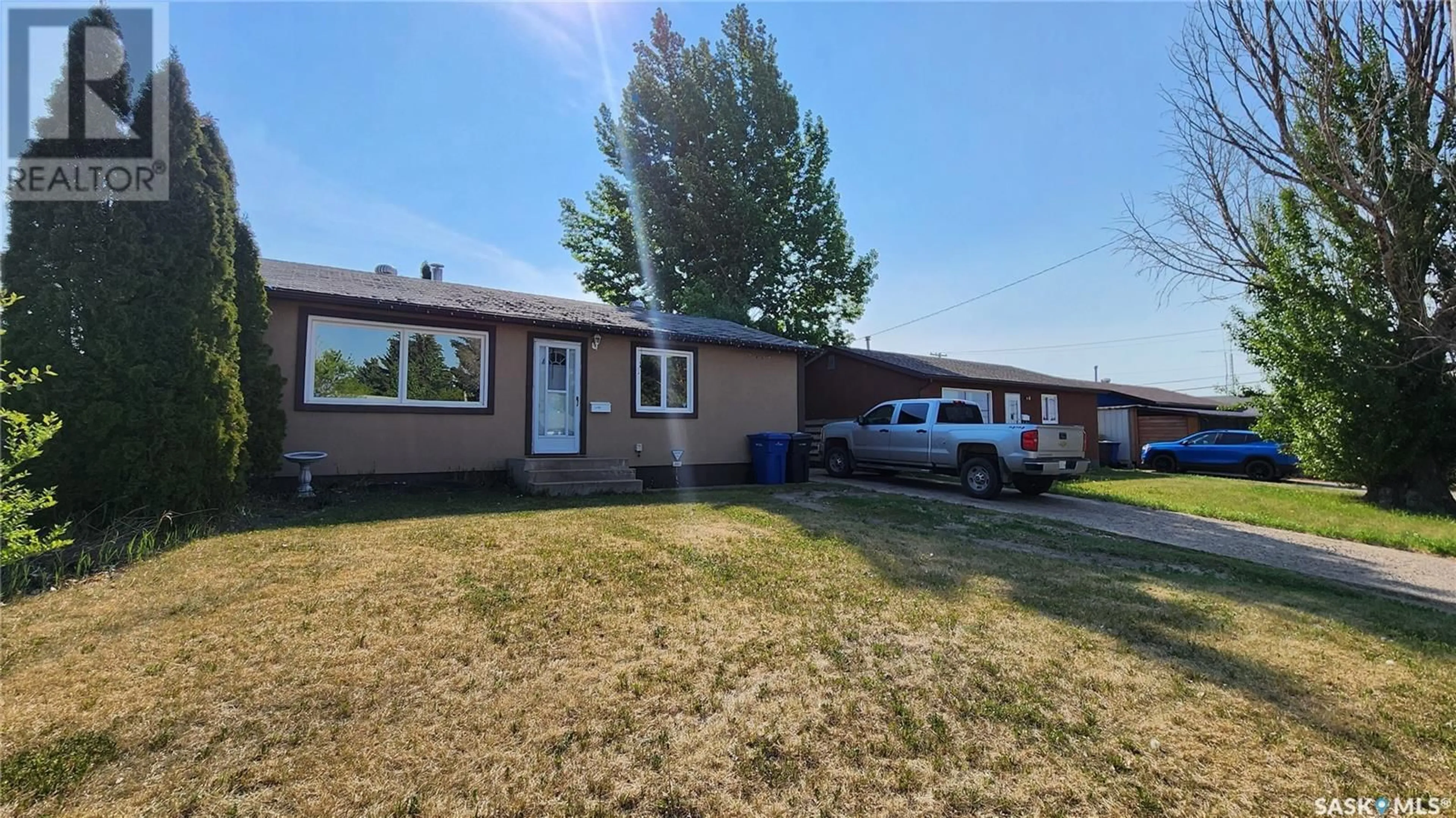 Home with vinyl exterior material, street for 1432 112TH STREET, North Battleford Saskatchewan S9A3B2