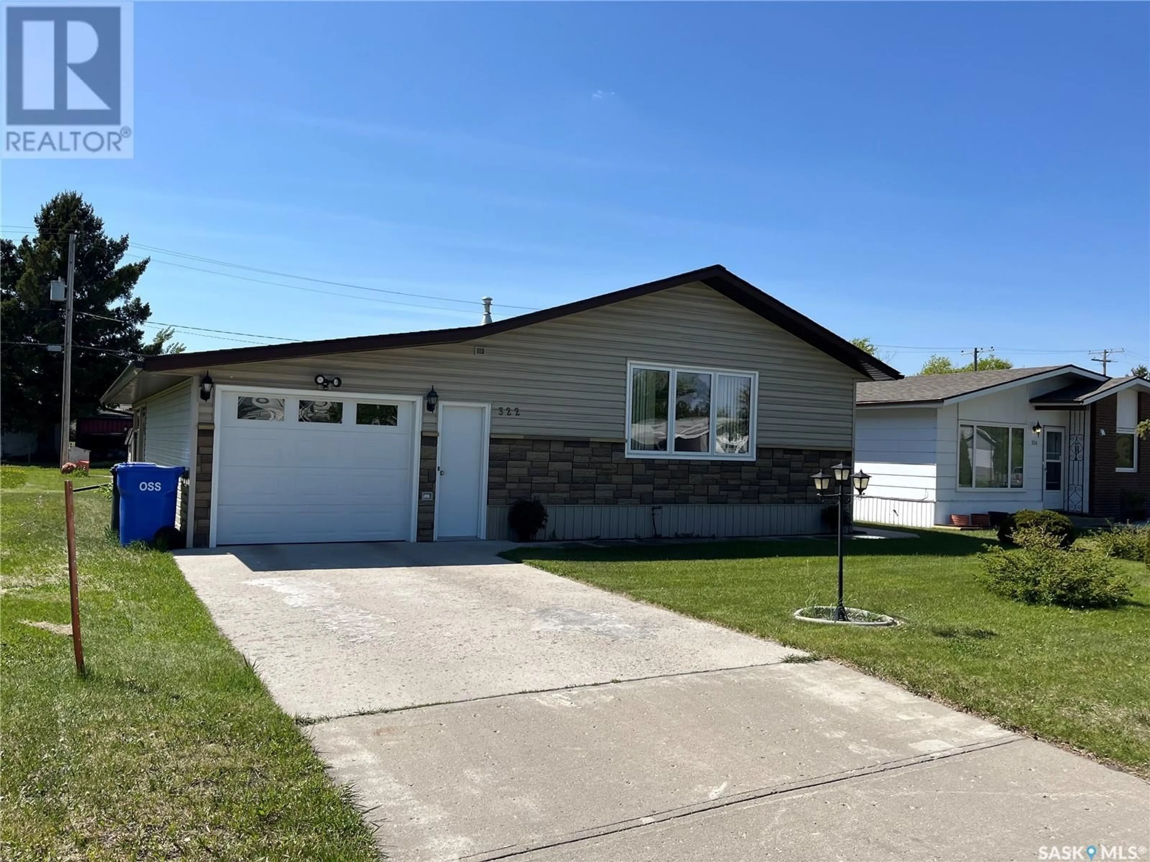 Home with vinyl exterior material, street for 322 FORGET STREET, Foam Lake Saskatchewan S0A1A0