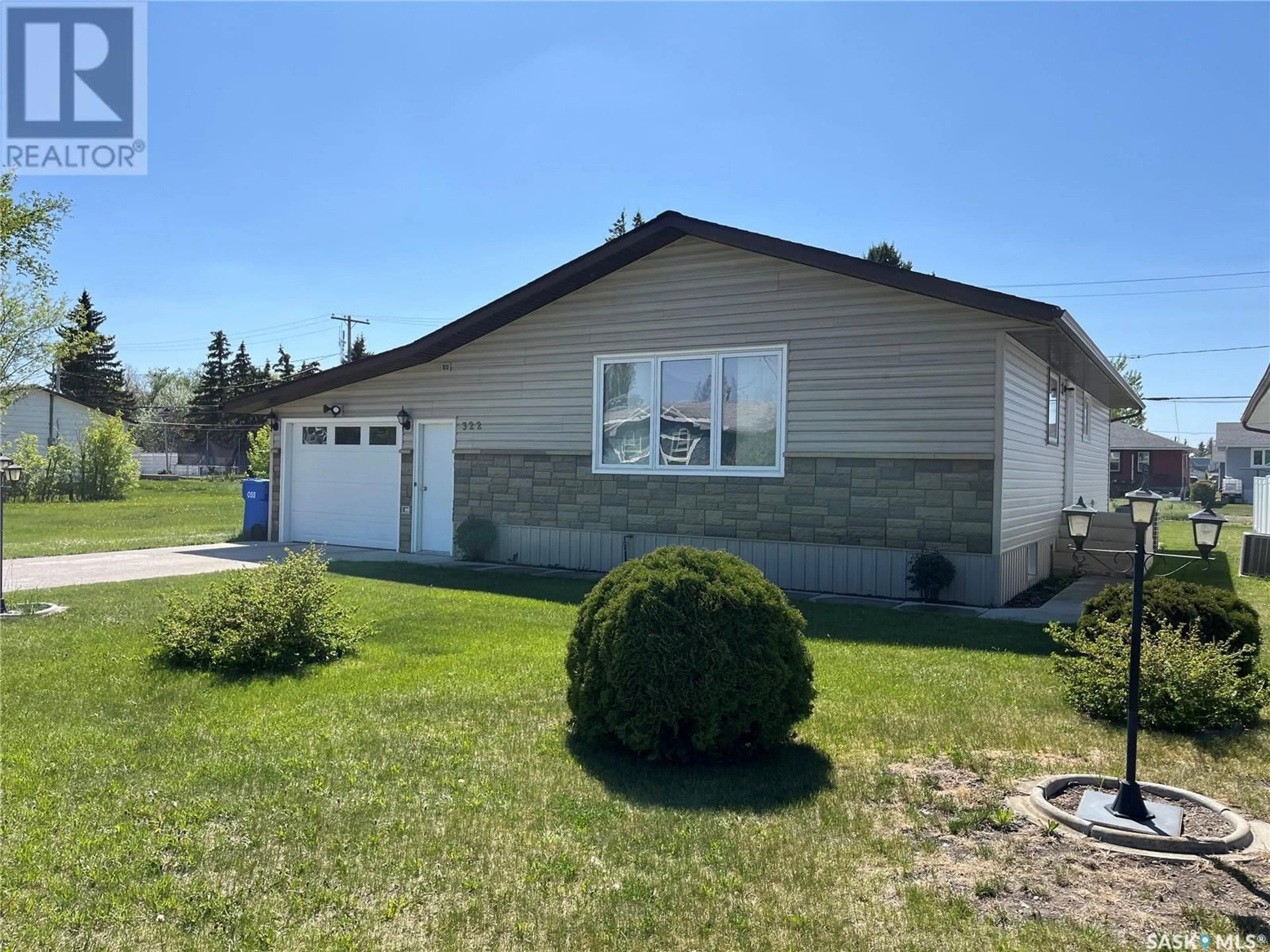 Home with vinyl exterior material, street for 322 FORGET STREET, Foam Lake Saskatchewan S0A1A0