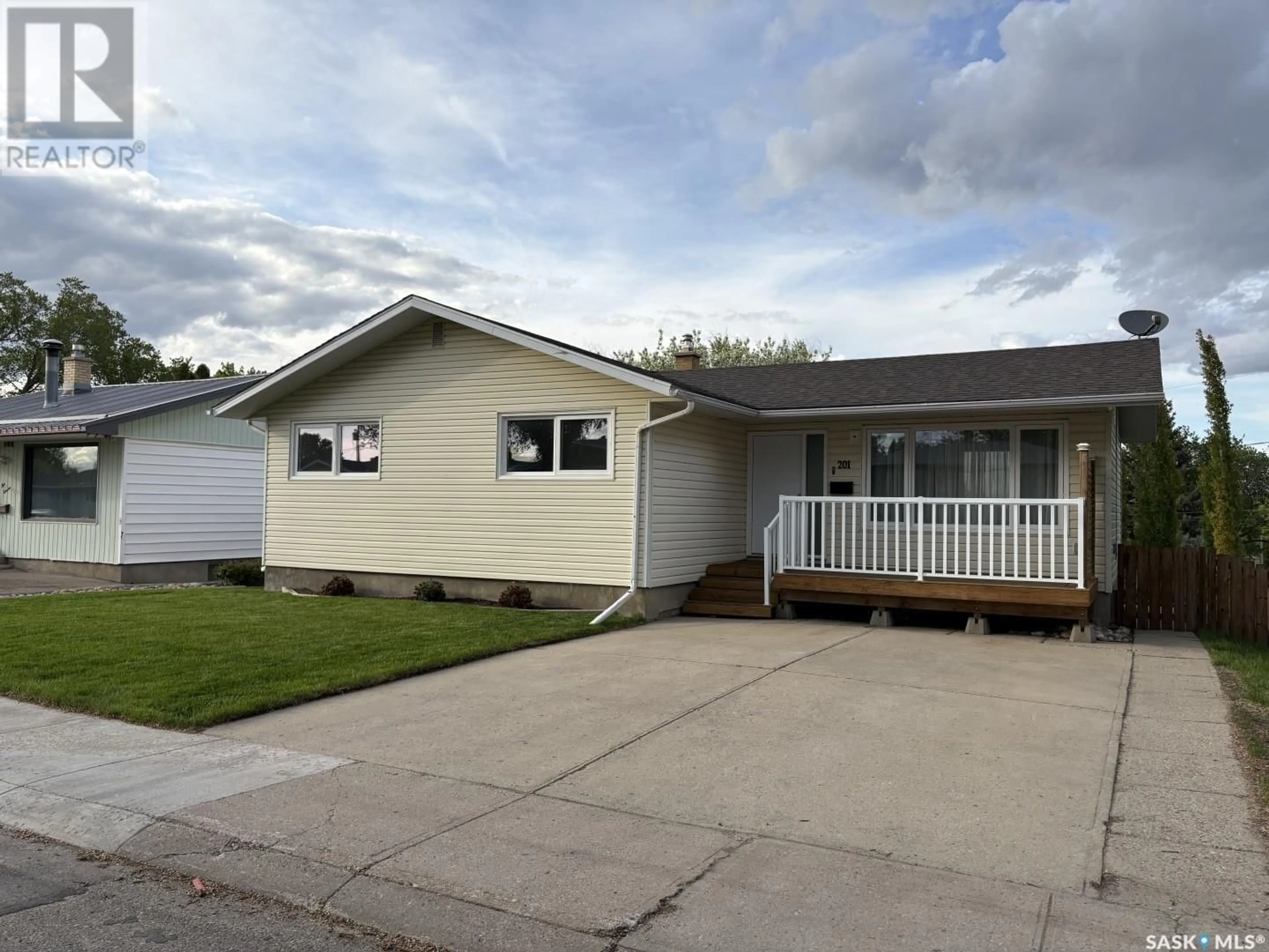 Home with vinyl exterior material, street for 201 CONLIN DRIVE, Swift Current Saskatchewan S9H3A9